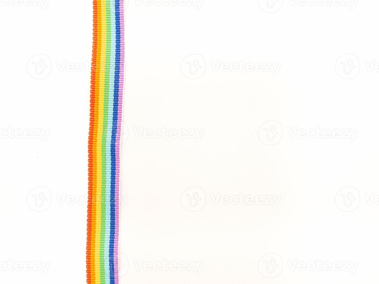 Close-up of a rainbow cloth ribbon on a white background. Top view. photo