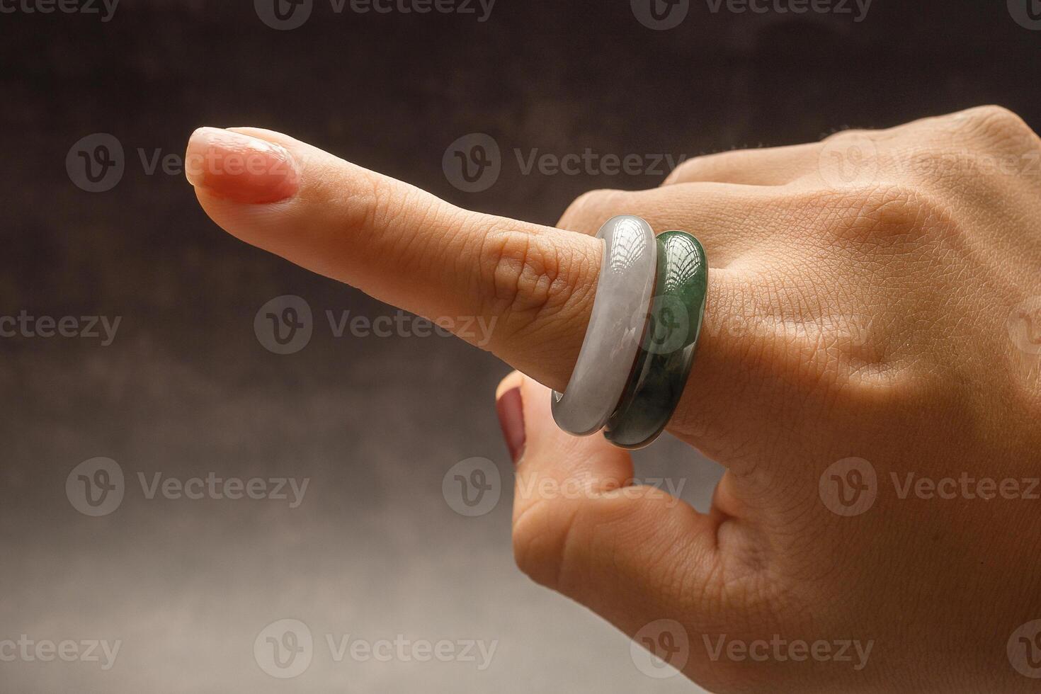 Close-up of woman's hand wearing a jade rings photo