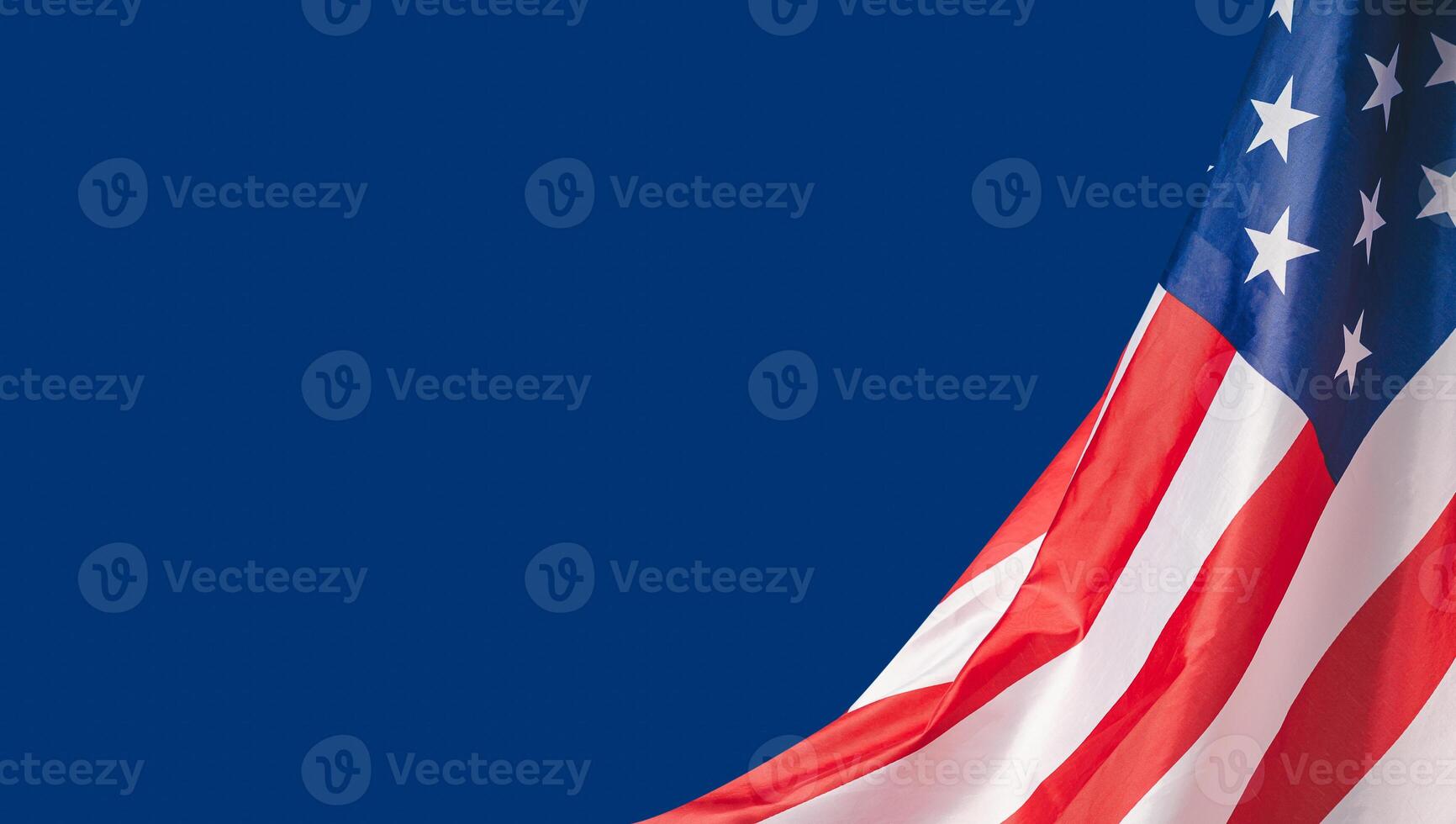 Part of the American flag is on a blue background. Space for text. photo