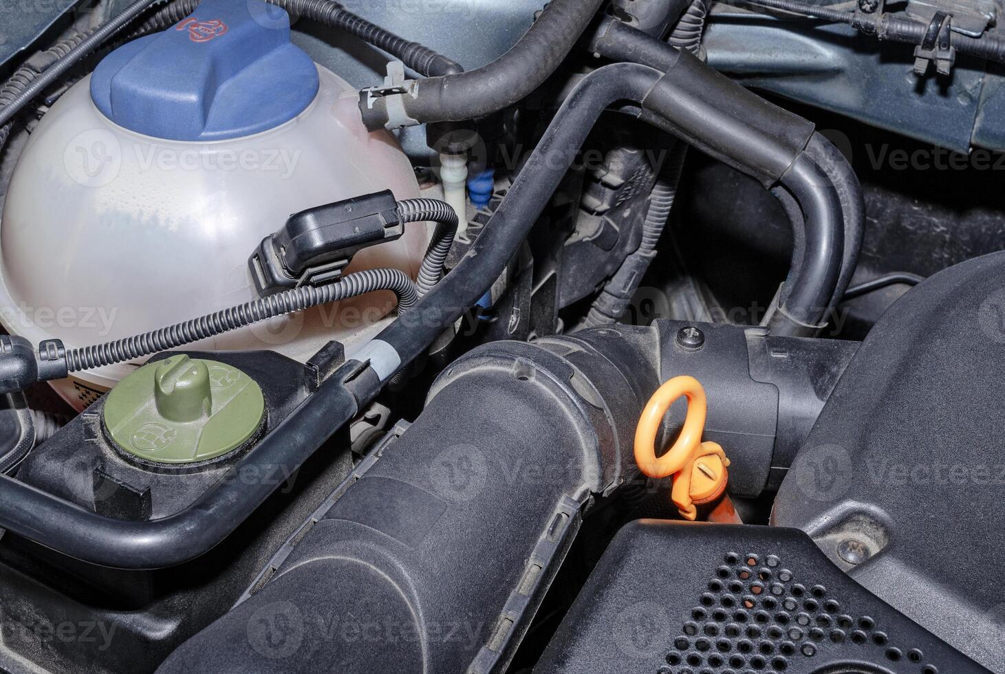 Car coolant reservoir and parts of the engine compartment photo