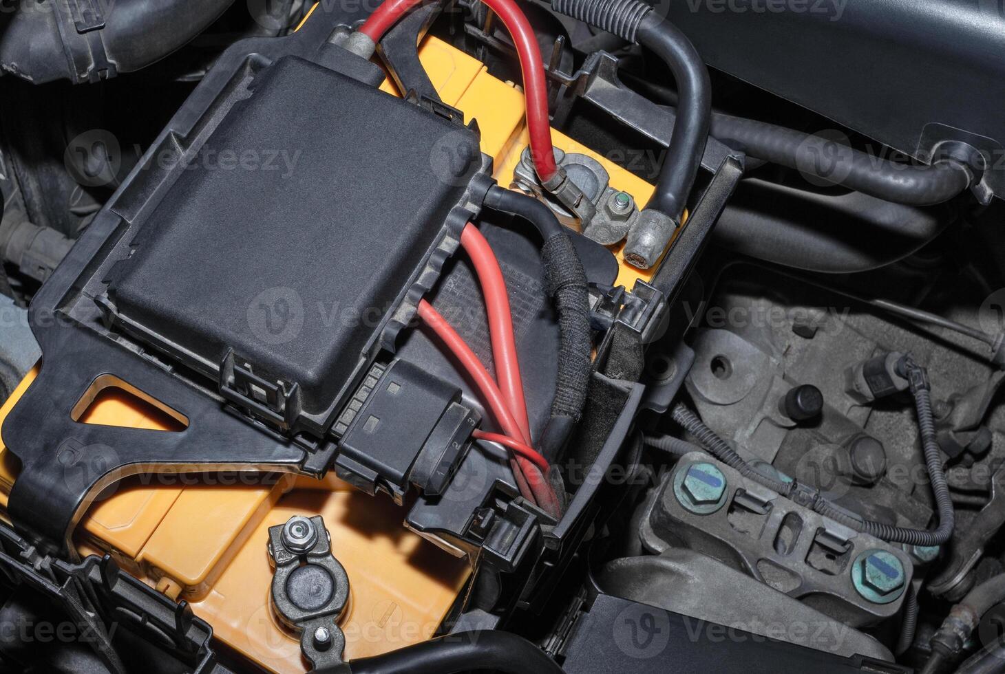 Car battery in the engine compartment photo