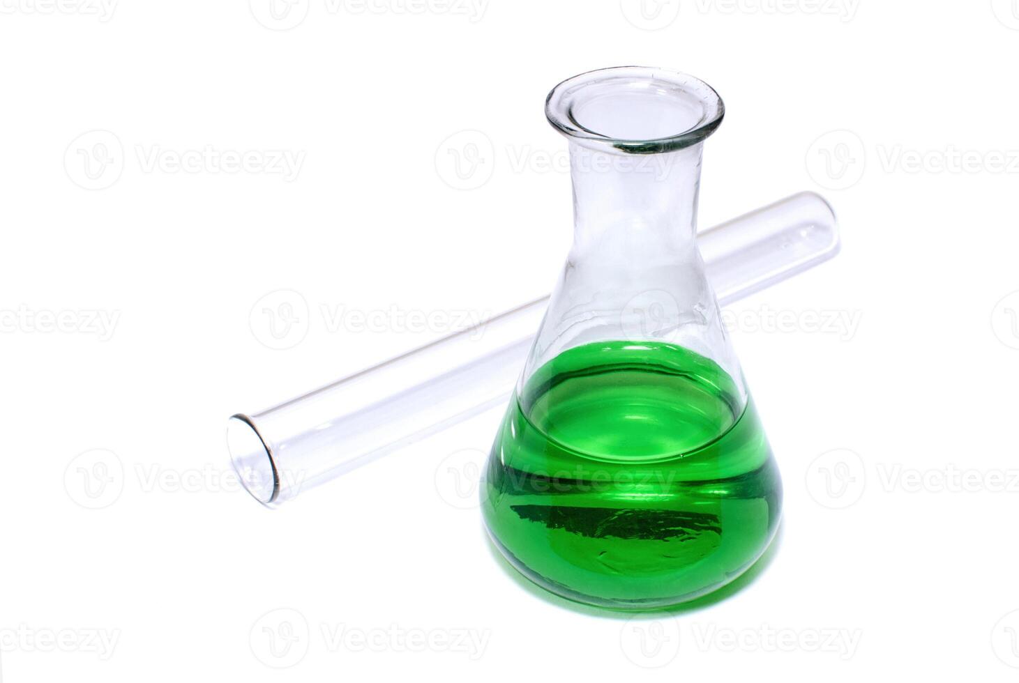 Chemical flask with green liquid and test-tube photo