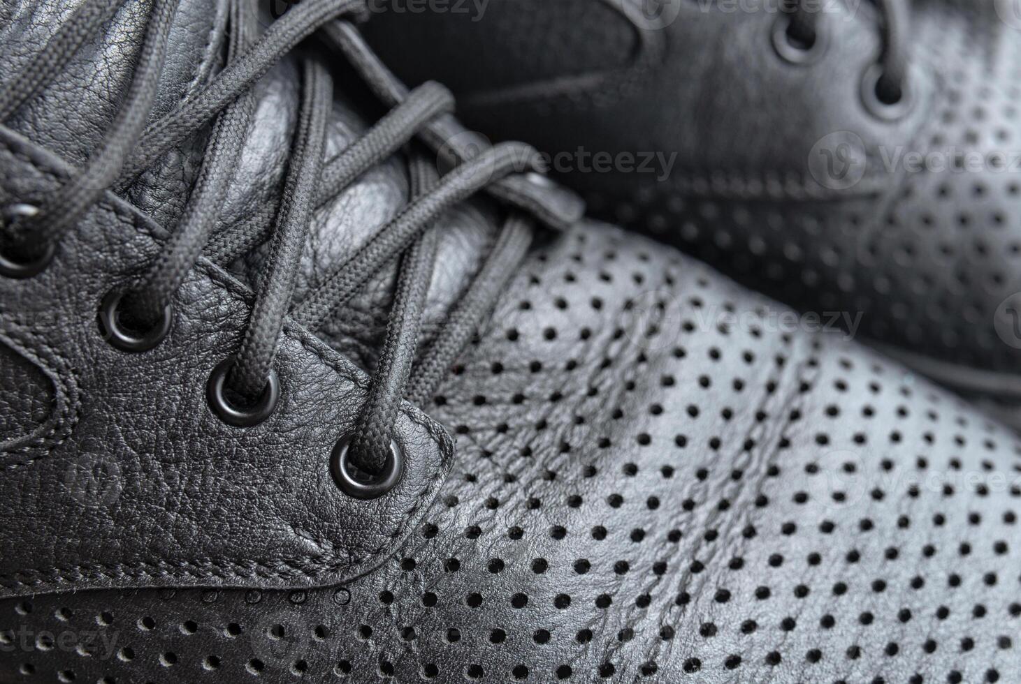 Black leather male shoes with laces closeup photo