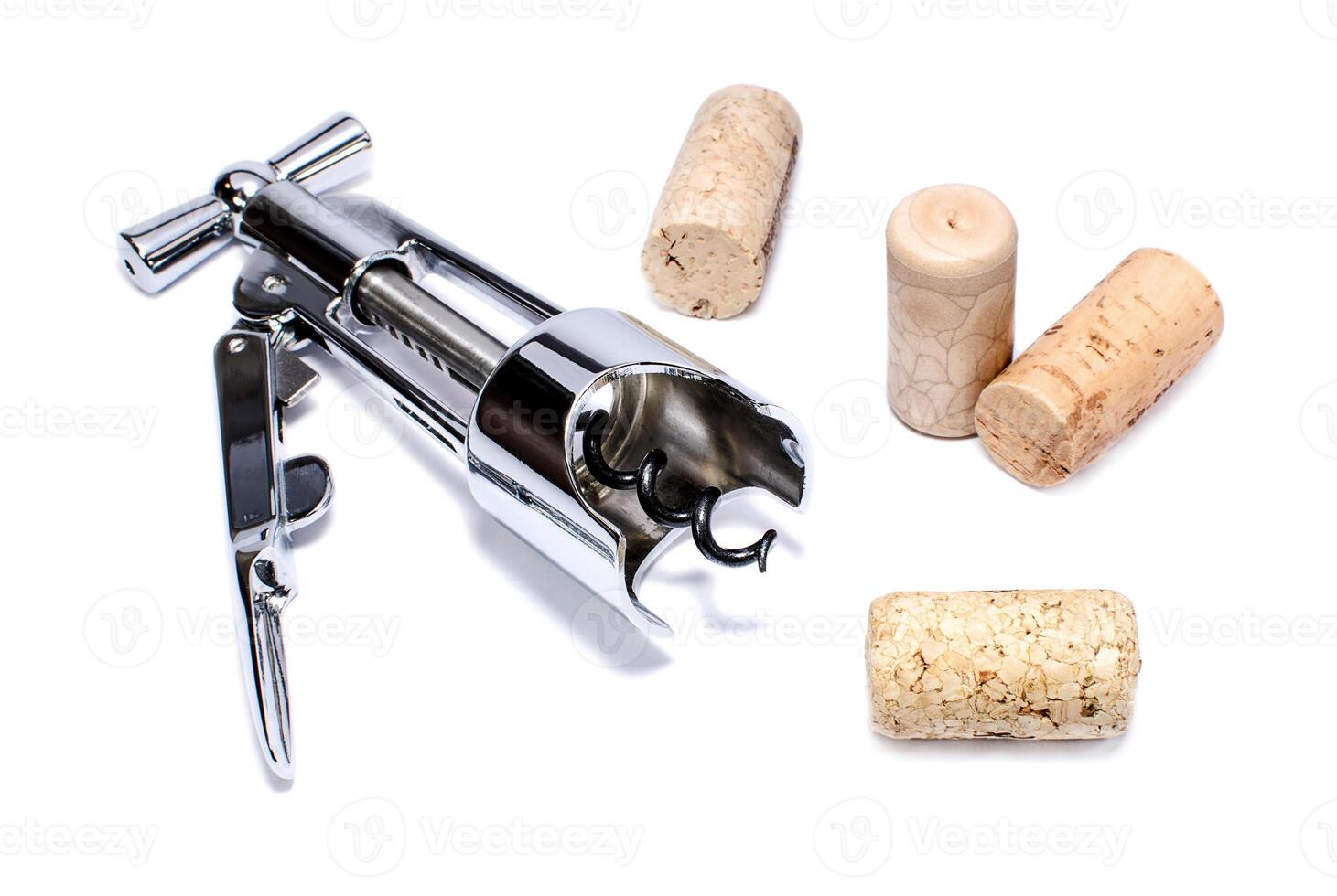 Corkscrew and wine corks isolated on white background photo