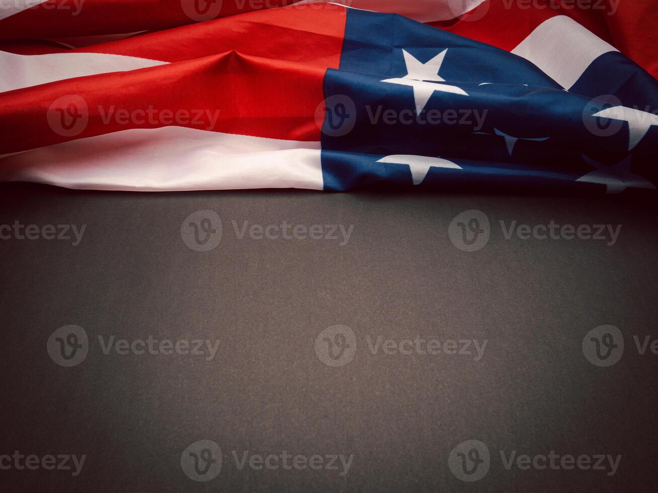 Part of the American flag is on a black background with copy space for text. Top view. photo