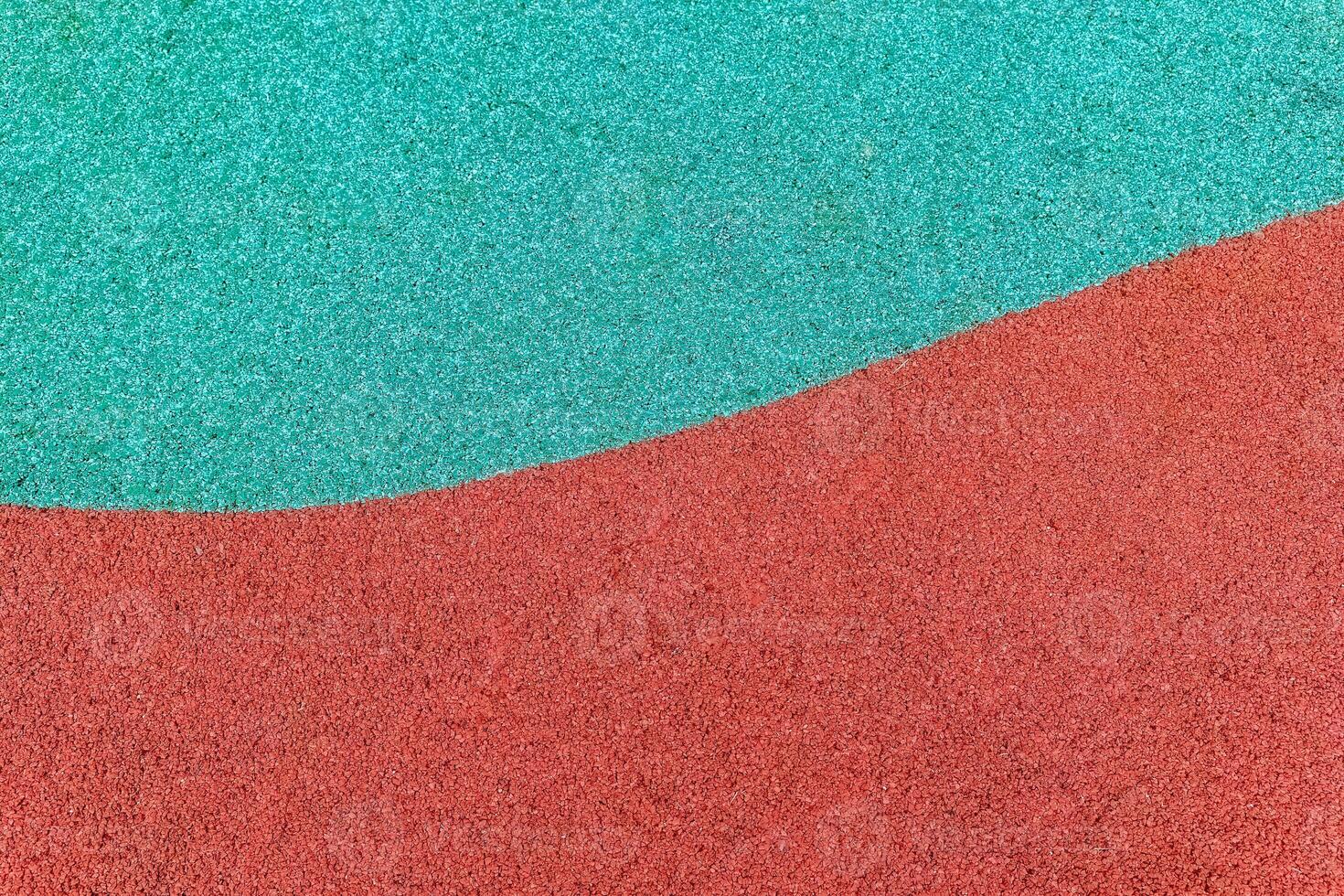 Vibrant colored sand design in a playground setting, showcasing contrasting textures and hues photo