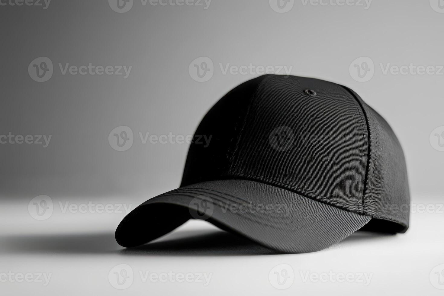 A black baseball cap on a table photo