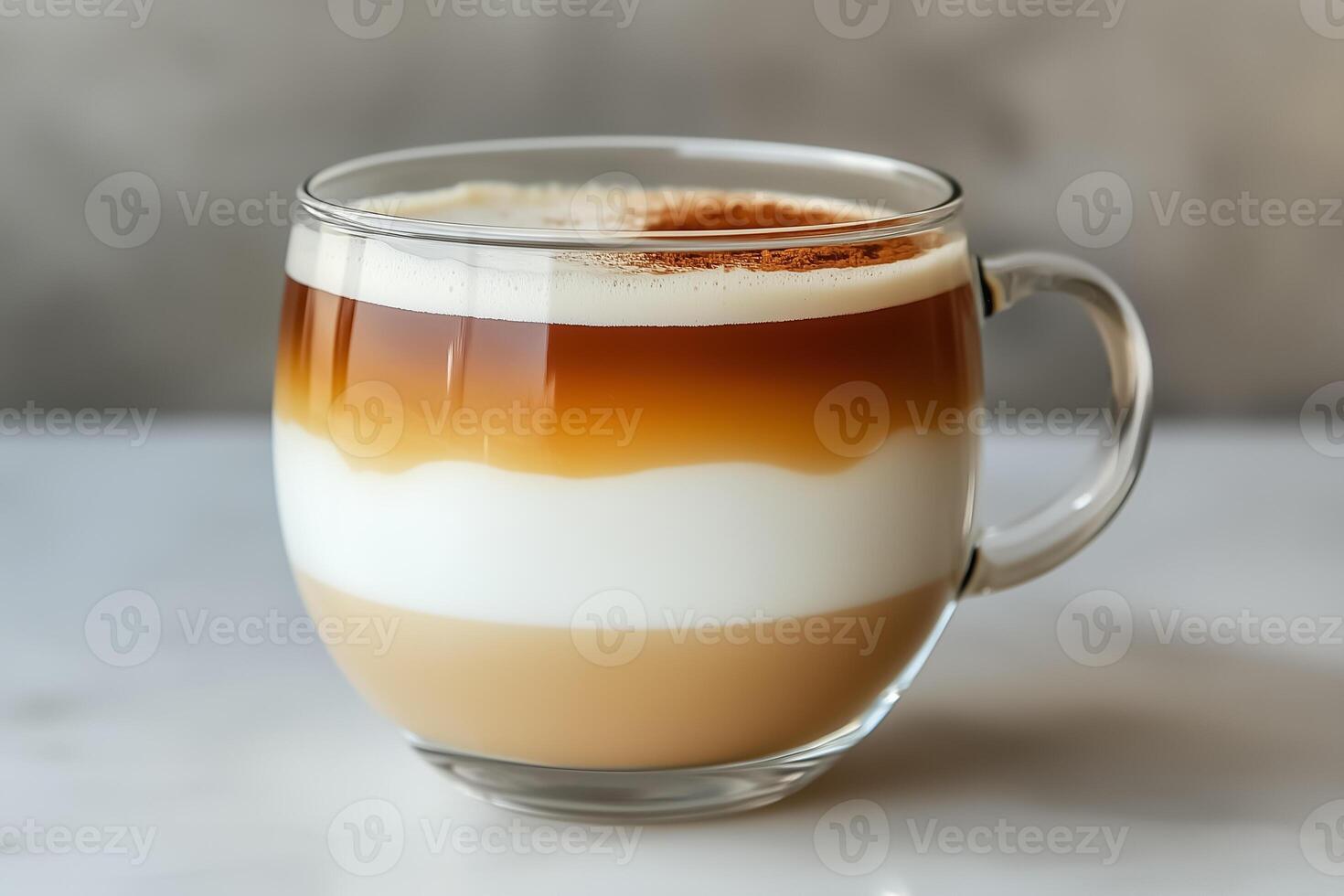 A glass of coffee with cream and caramel photo