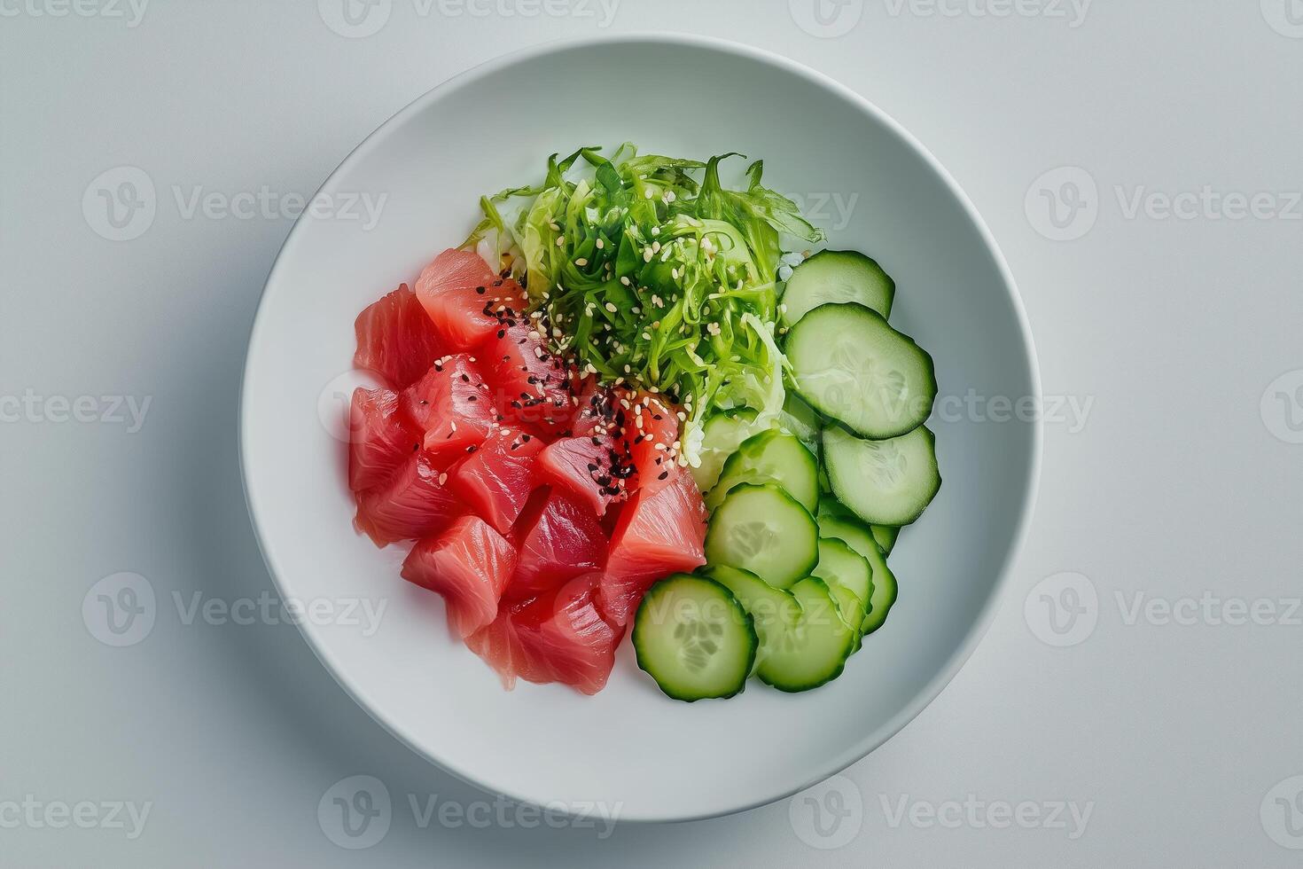 A plate with sliced cucumbers and salmon photo