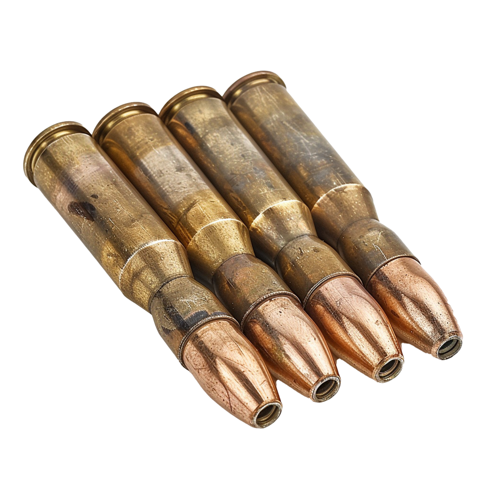 Closeup of Four Spent Rifle Cartridges or Bullets Showing Details of Brass Casings and Copper Jackets png
