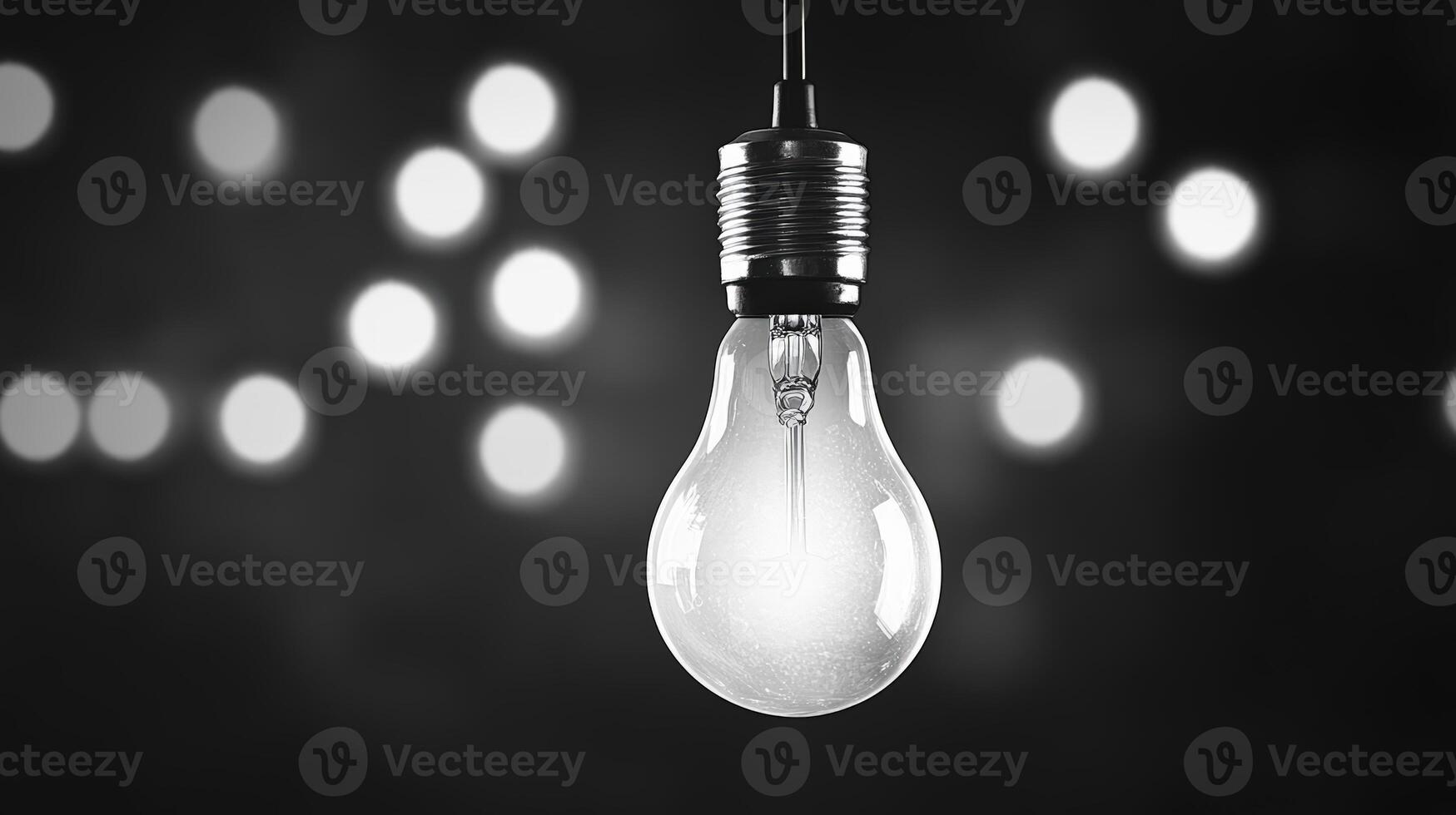 Glowing Lightbulb In Black And White Bokeh Backgrounds Style photo