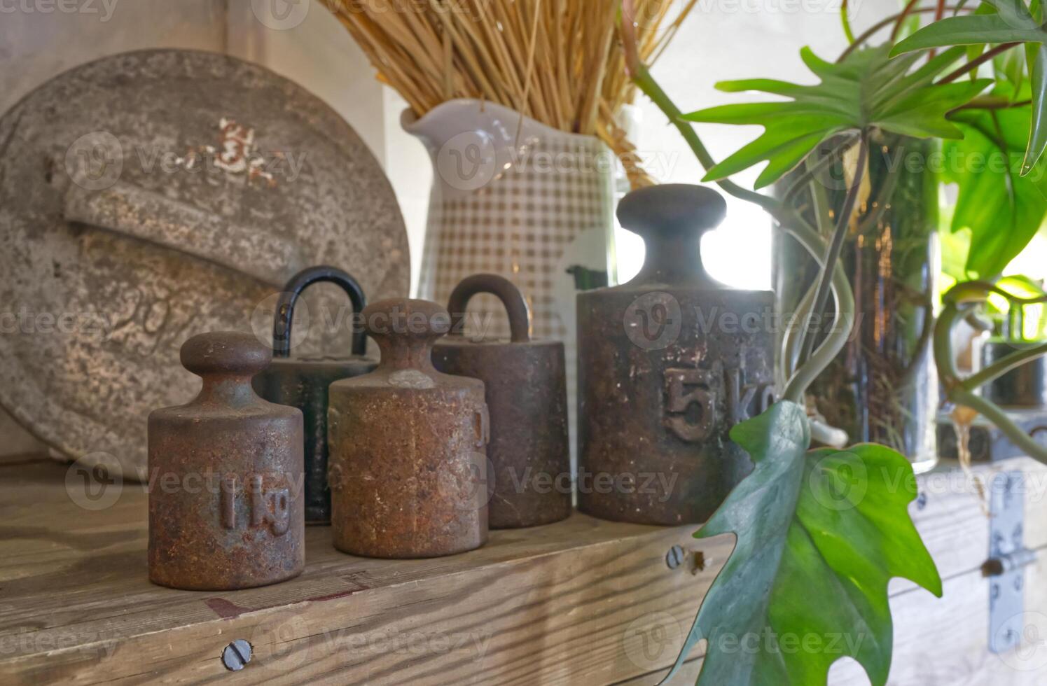 Rustic Kitchen Shelf with Vintage Weights and Decor photo