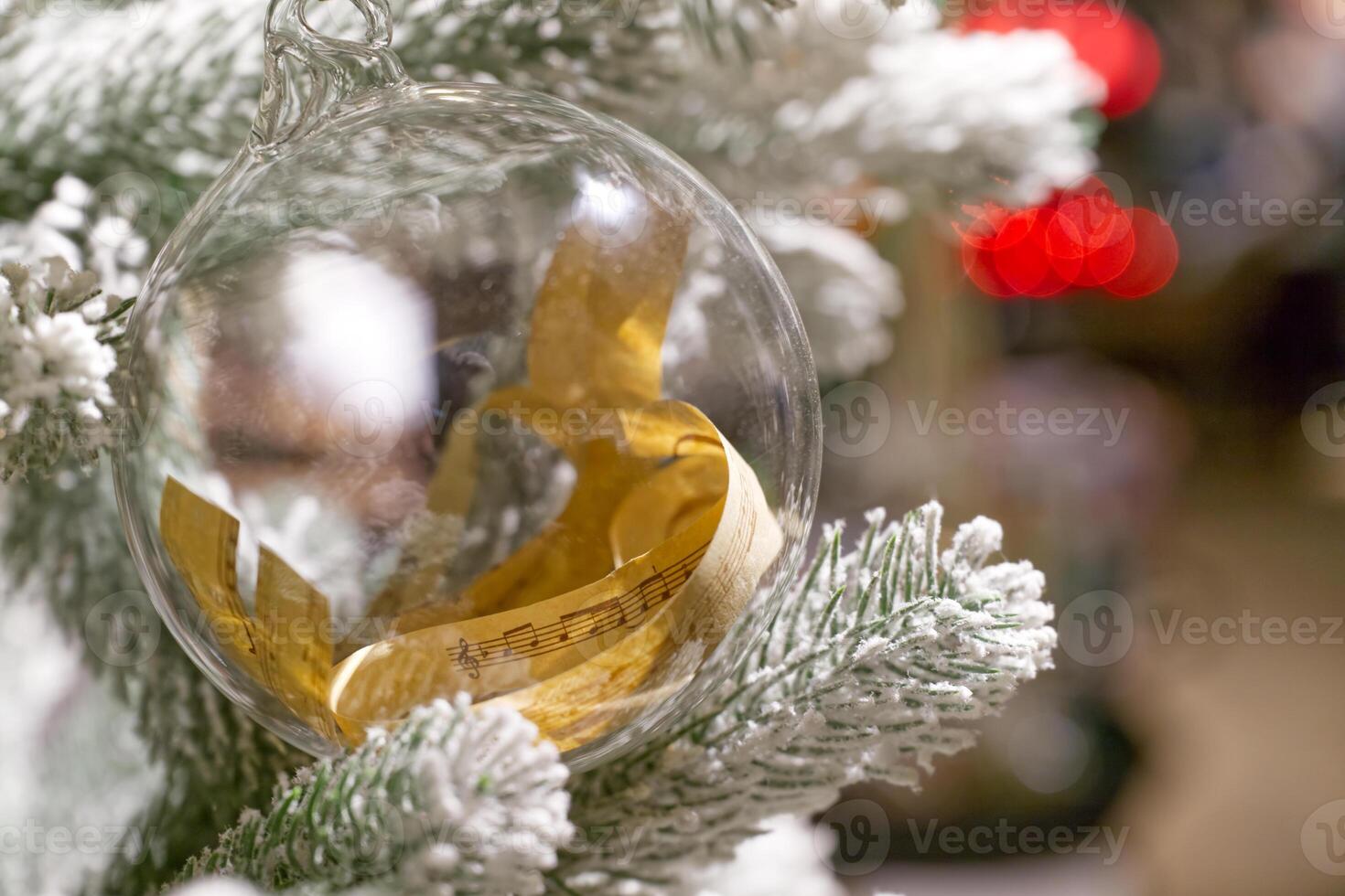 Christmas Ornament with Sheet Music on Pine Branch photo