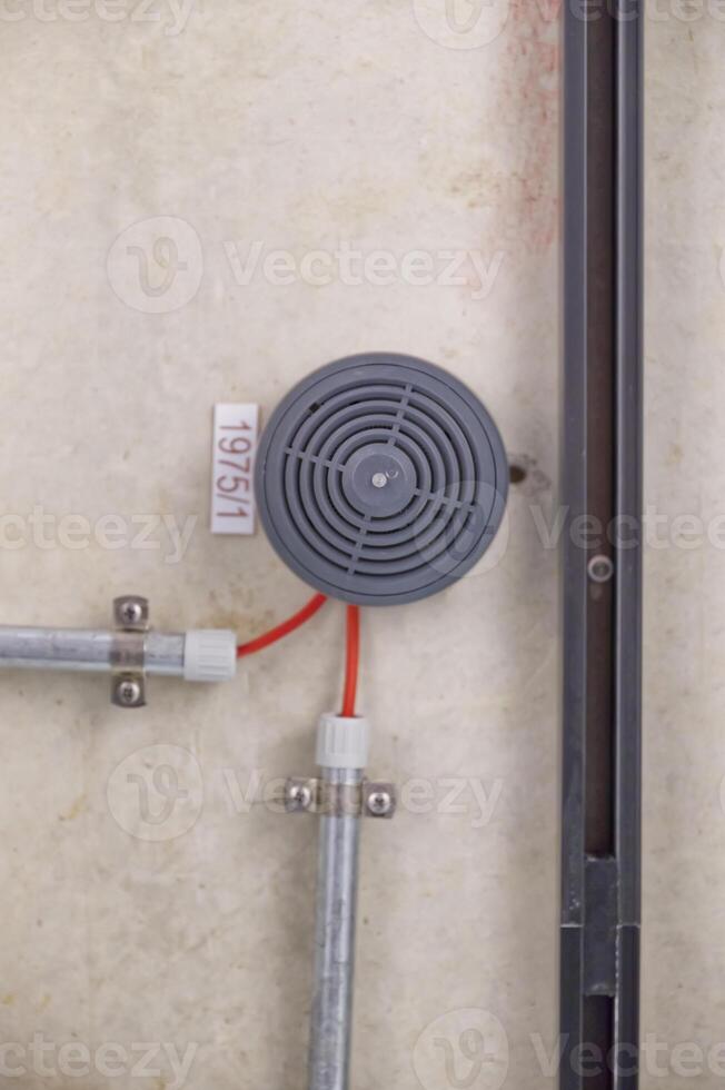 Close-Up of Gray Circular Device with Wires photo