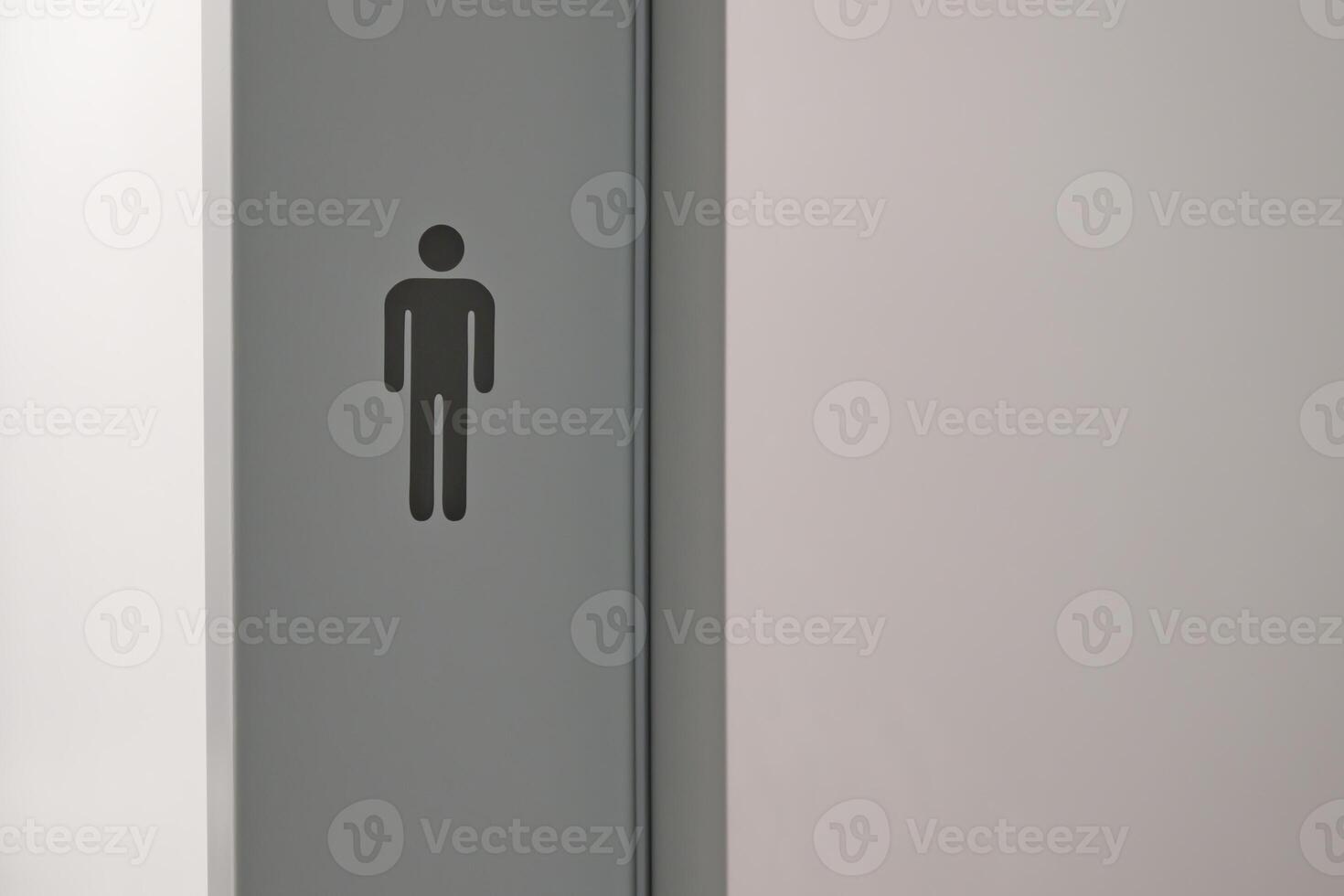Minimalist Male Restroom Sign on Gray Wall photo