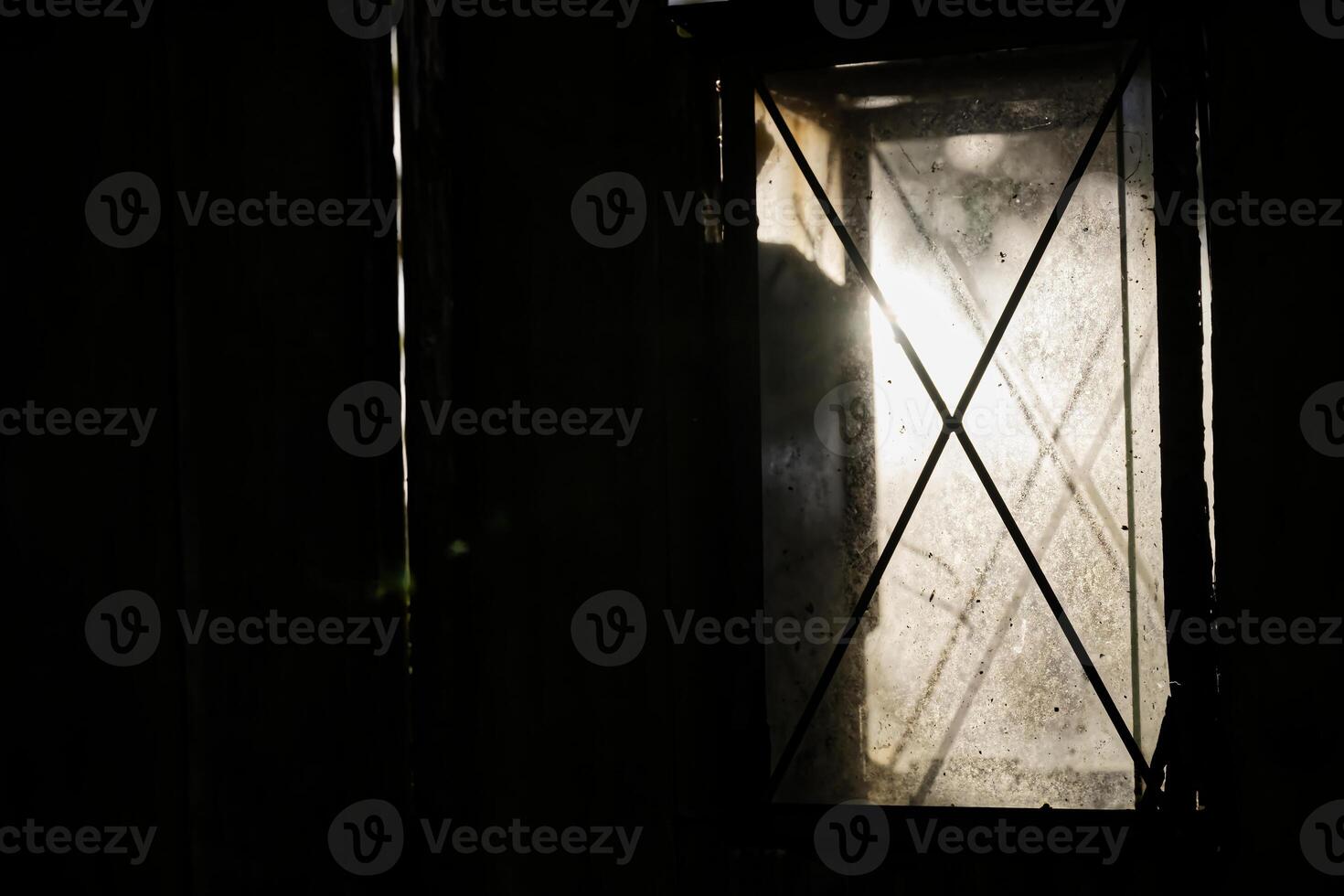 Dimly Lit Window with Crisscross Pattern photo
