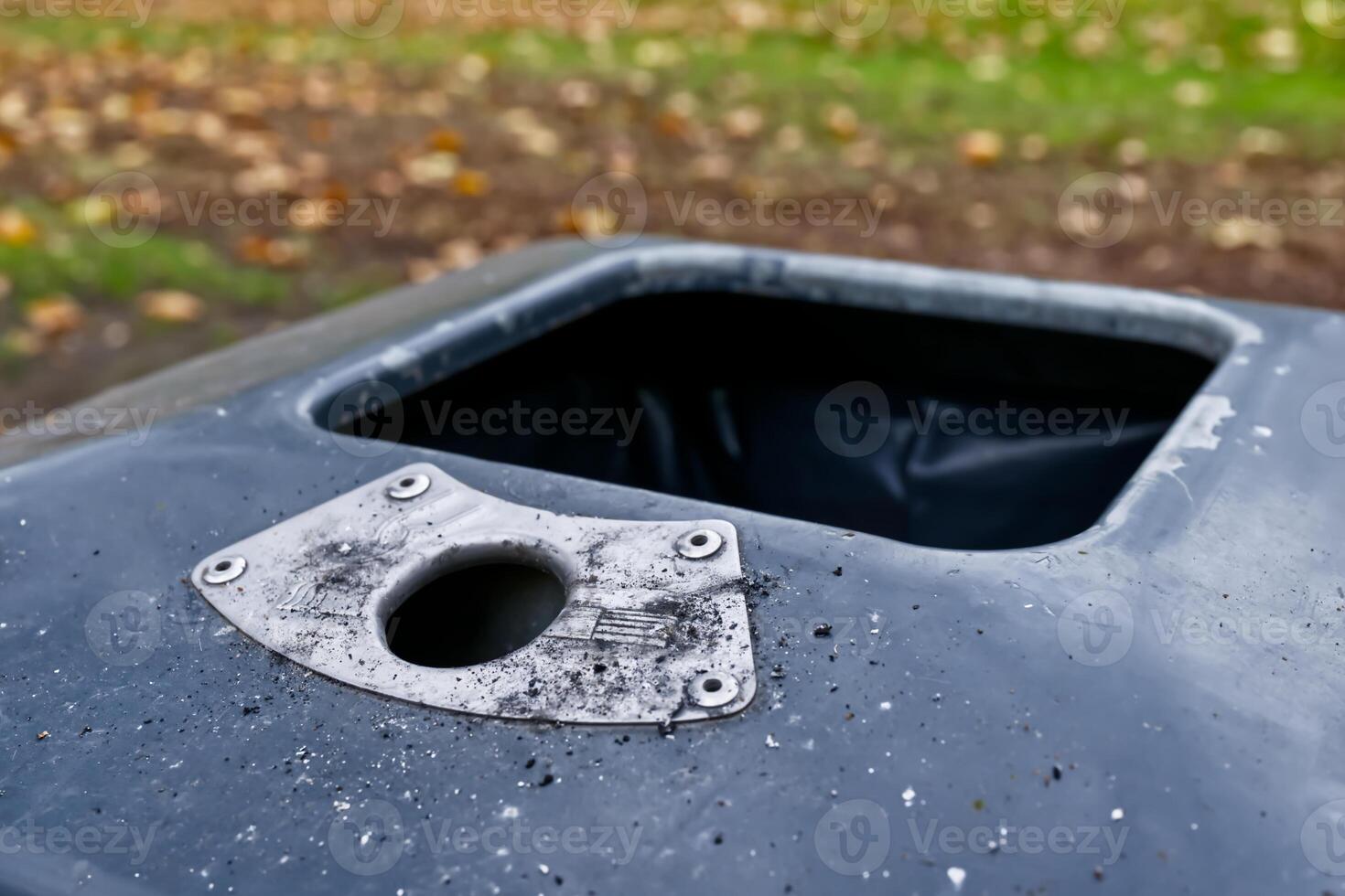 Close-Up of a Dirty Trash Bin photo