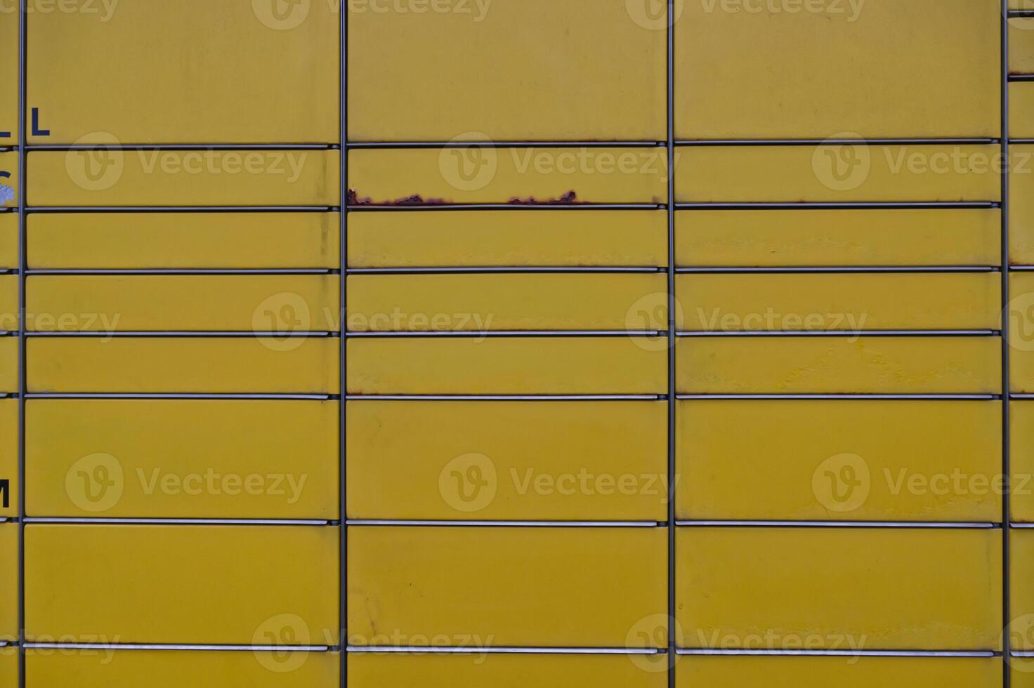 Close-up of Yellow Metal Surface with Rust photo