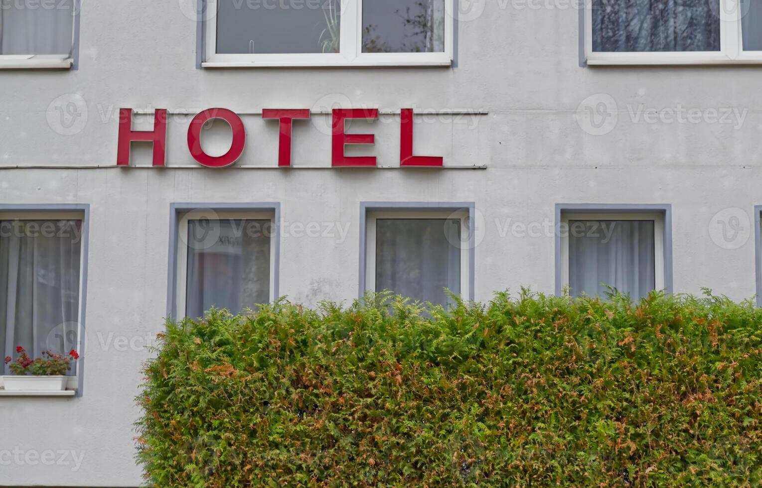 Hotel Building with Red Sign photo