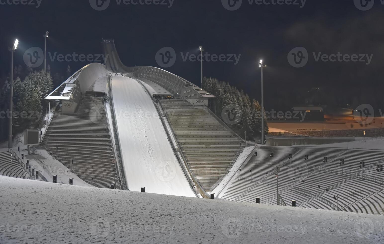 Illuminated Ski Jump Ramp at Night photo