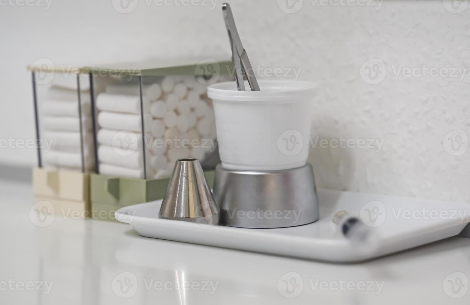 Organized Dental Workspace with Tools and Cotton Rolls photo