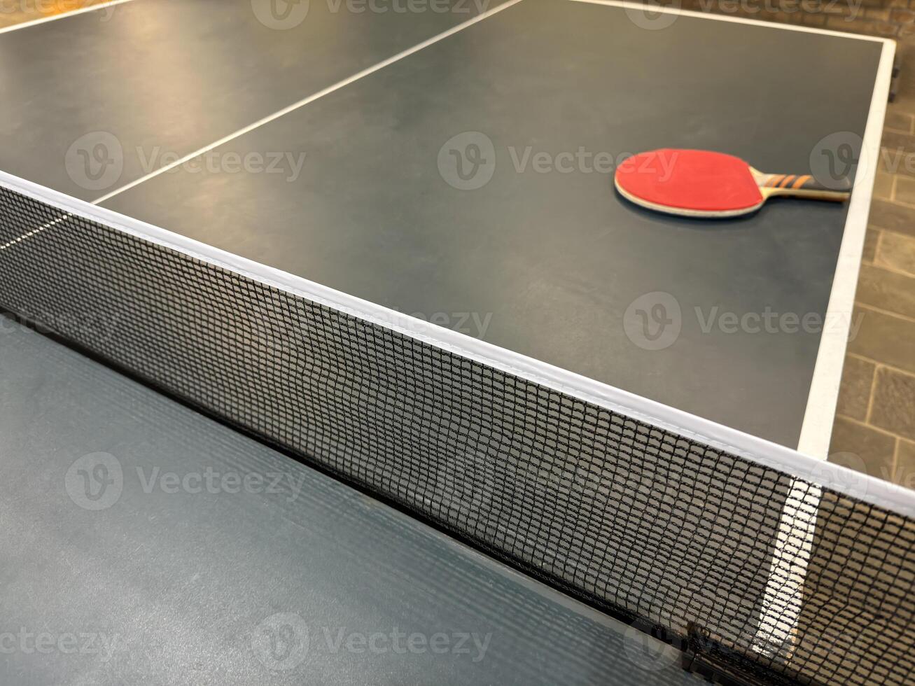 Close-Up of Table Tennis Setup with Paddle photo