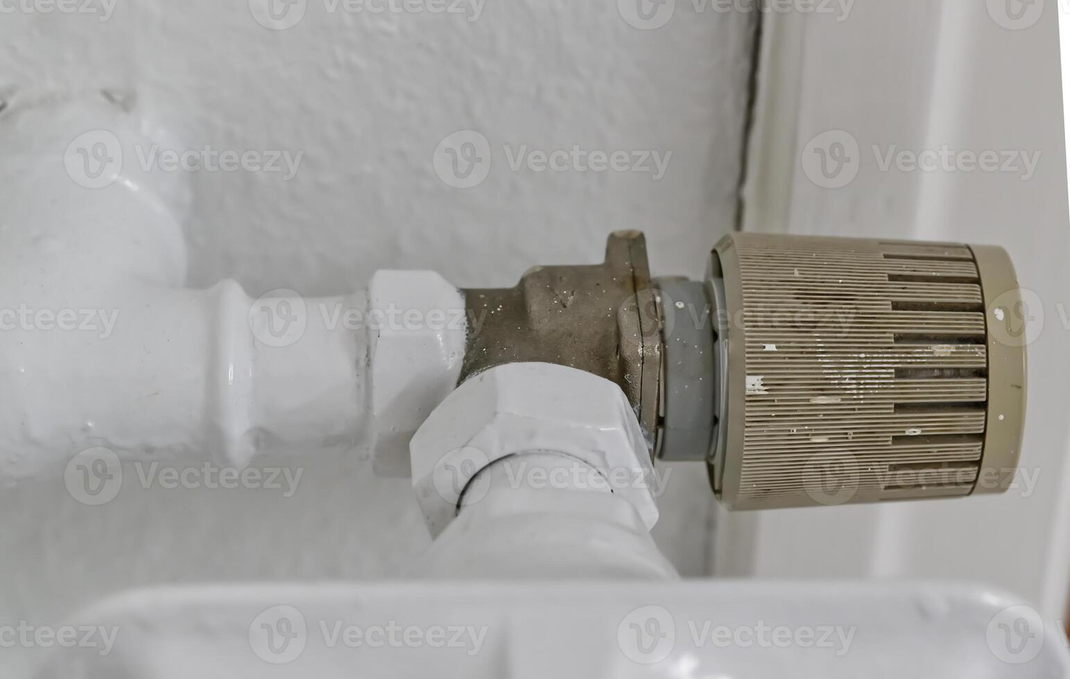 Close-Up of a Metal Valve and Pipes photo