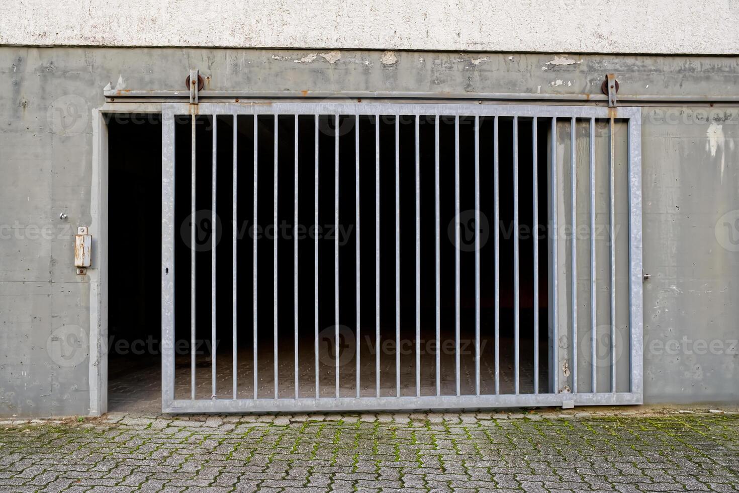 Industrial Metal Gate with Dark Interior photo