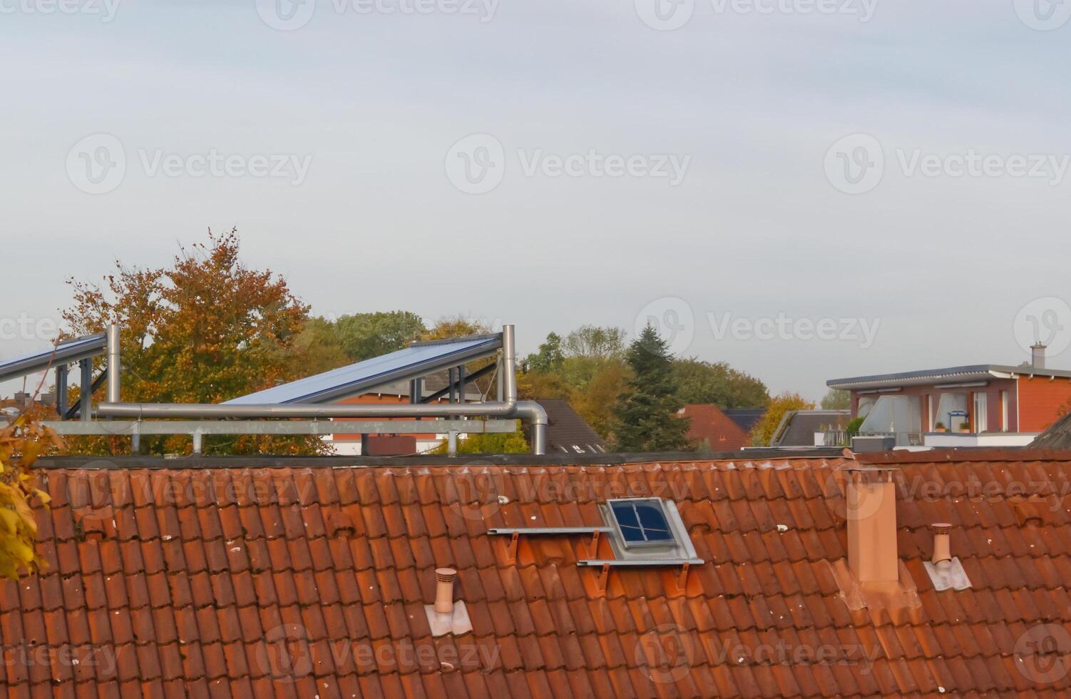 Rooftops with Solar Panels in a Residential Area photo
