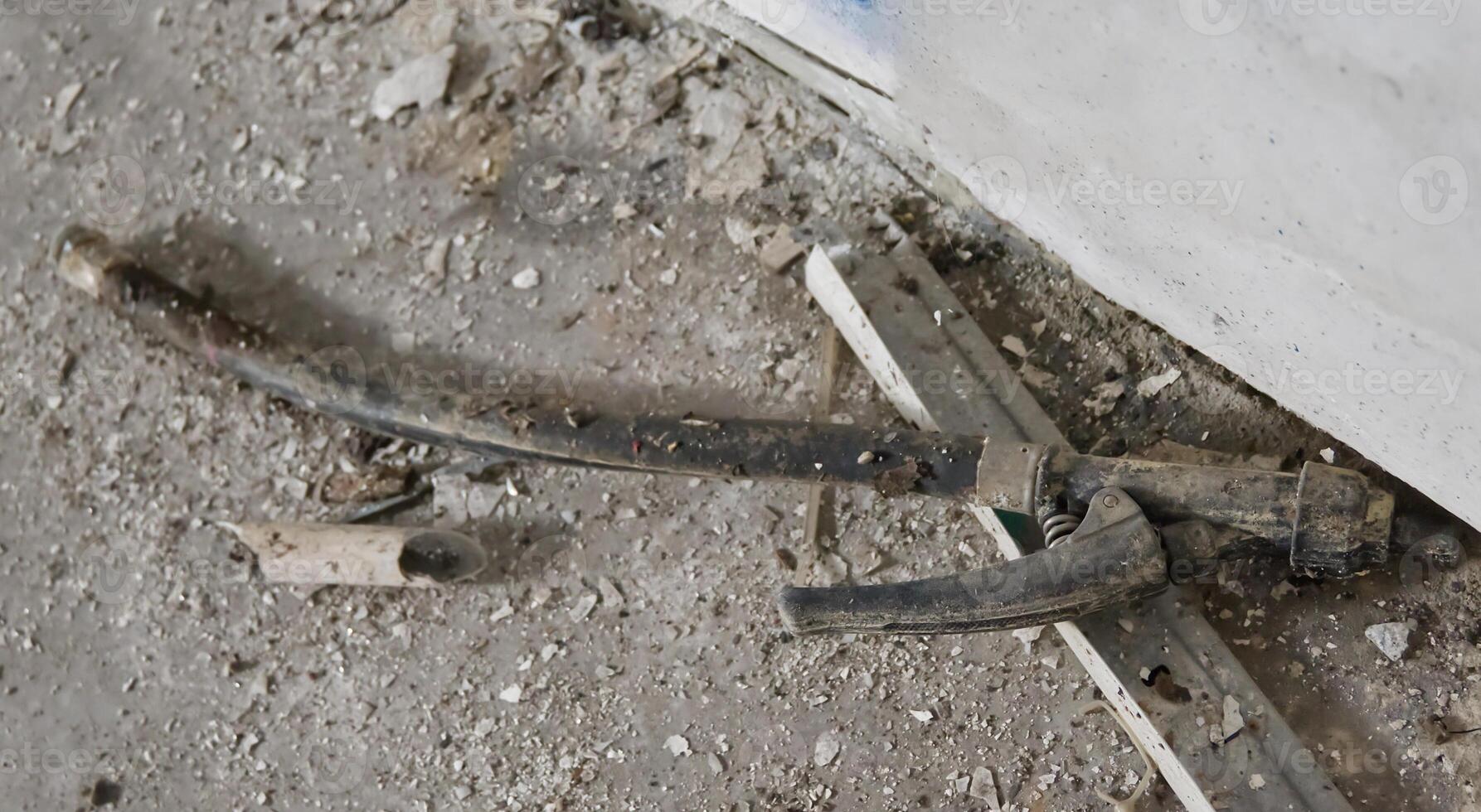 Old Worn Hose on Dusty Floor photo