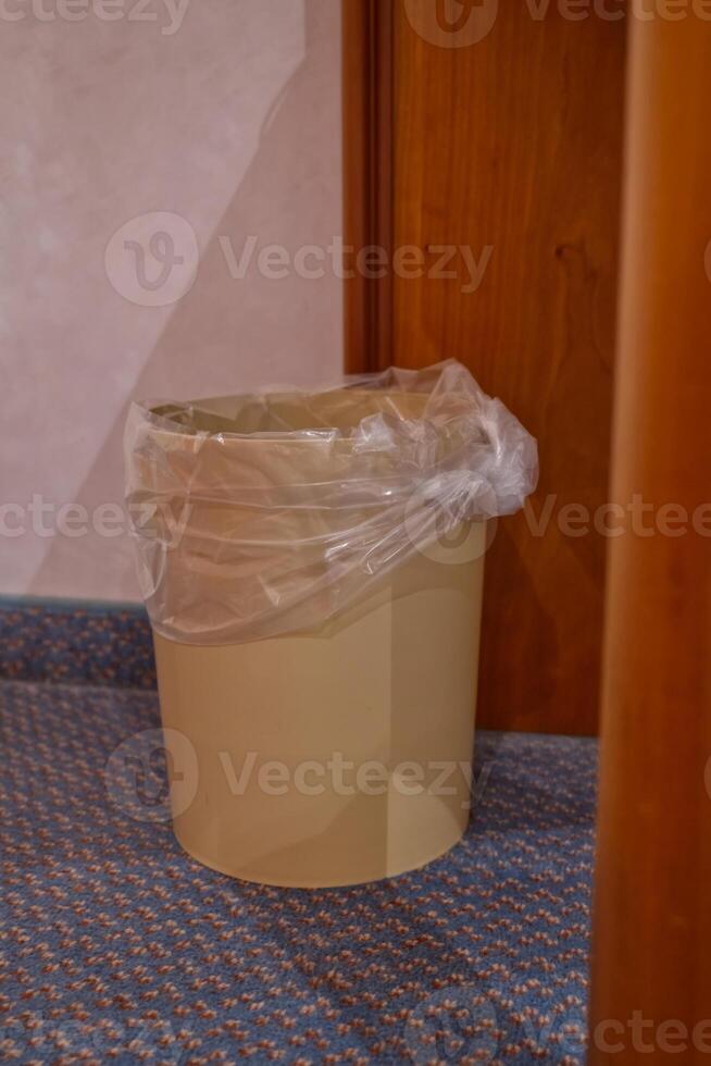 Beige Trash Can with Plastic Liner photo