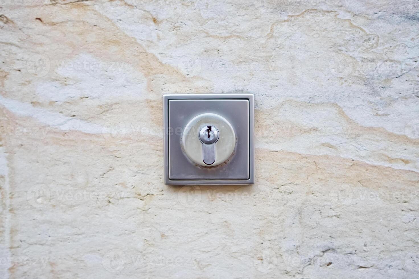 Close-up of a Keyhole on a Stone Wall photo