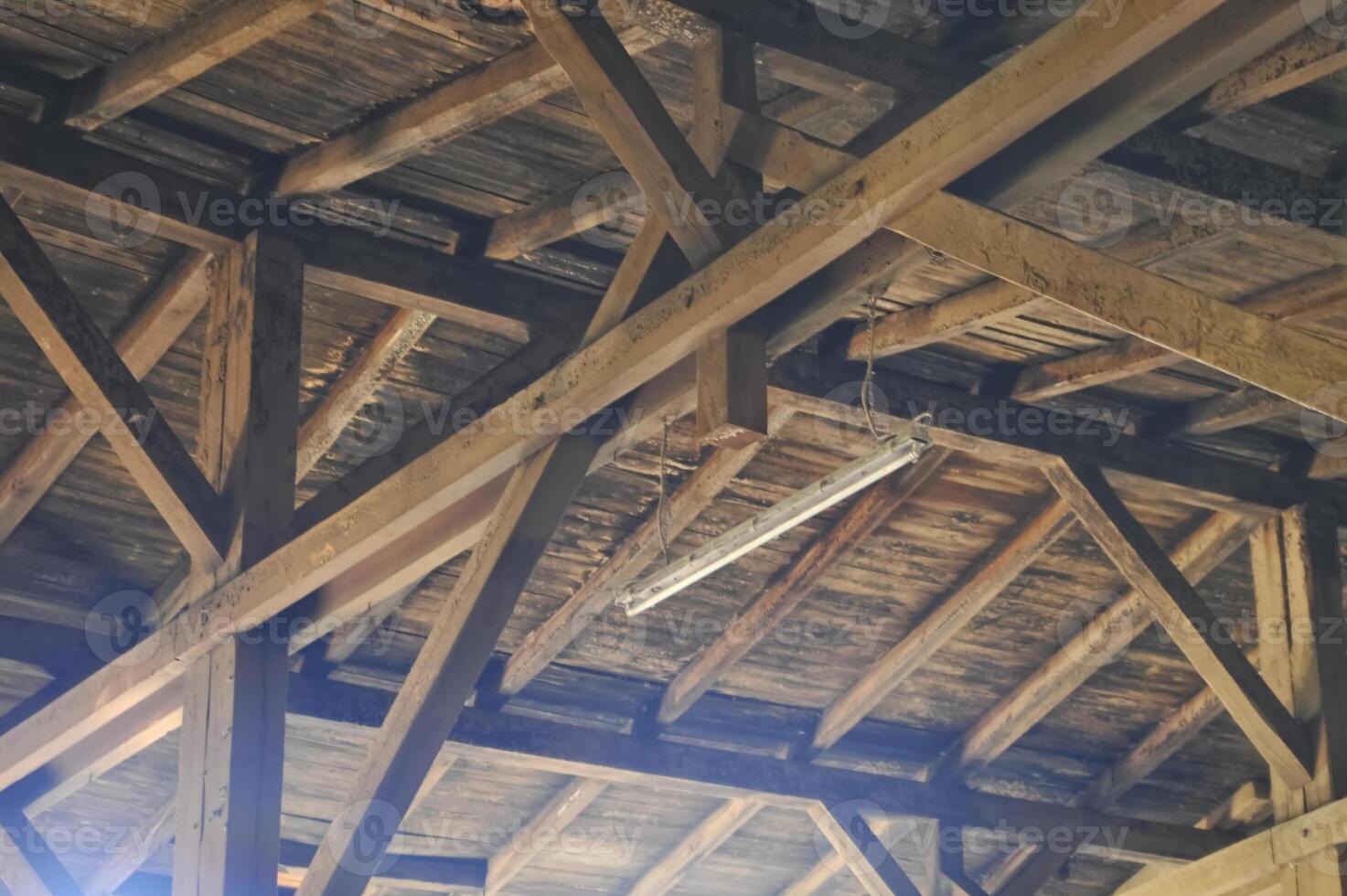 Rustic Wooden Ceiling with Hanging Light photo
