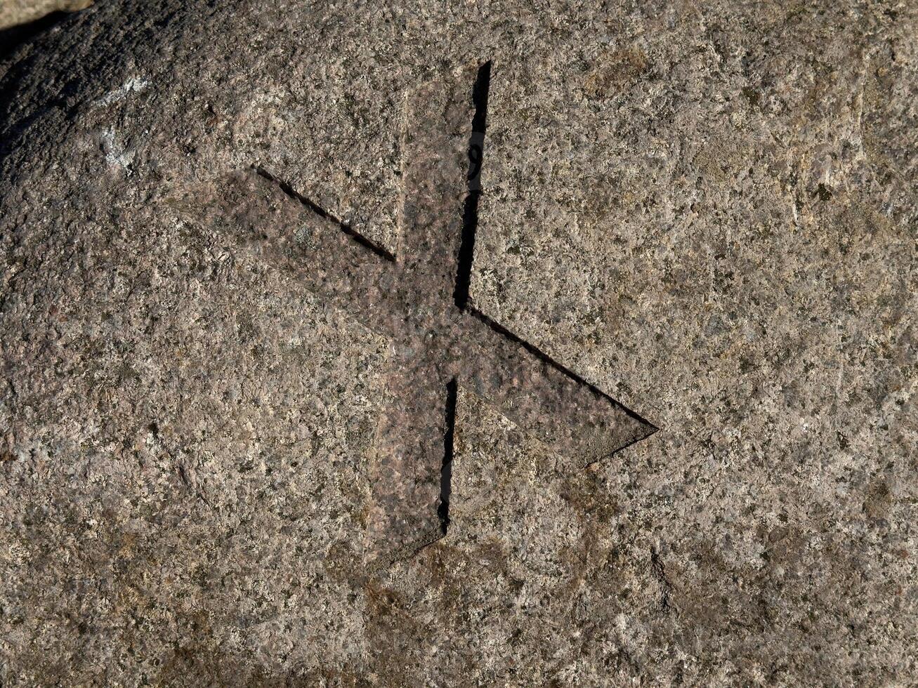 Carved Stone Cross Symbol X photo