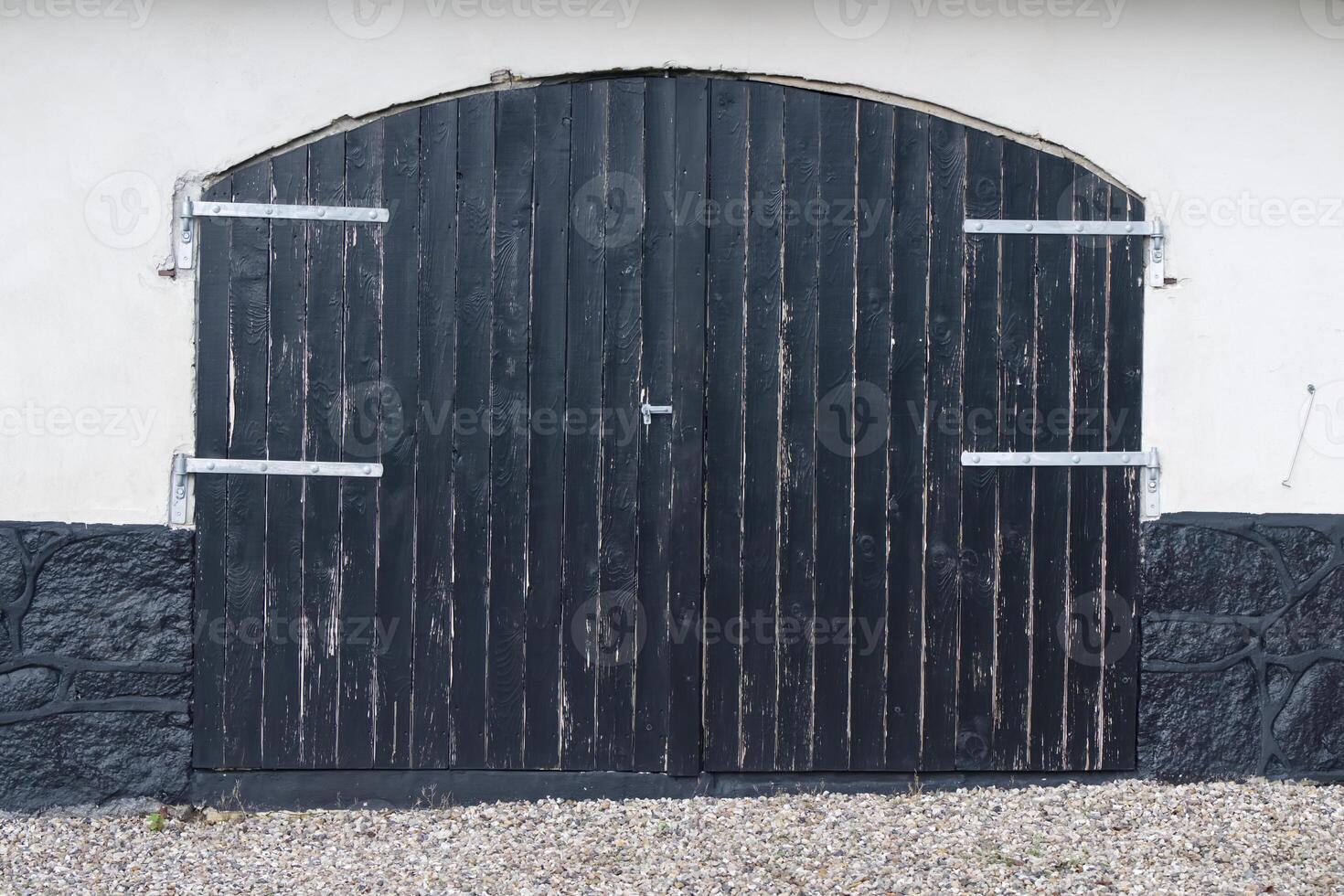 Arched Black Wooden Door photo