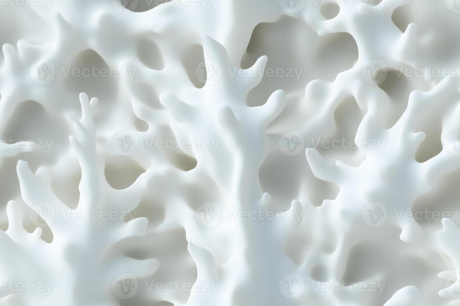 A close up of a white surface with many small holes photo