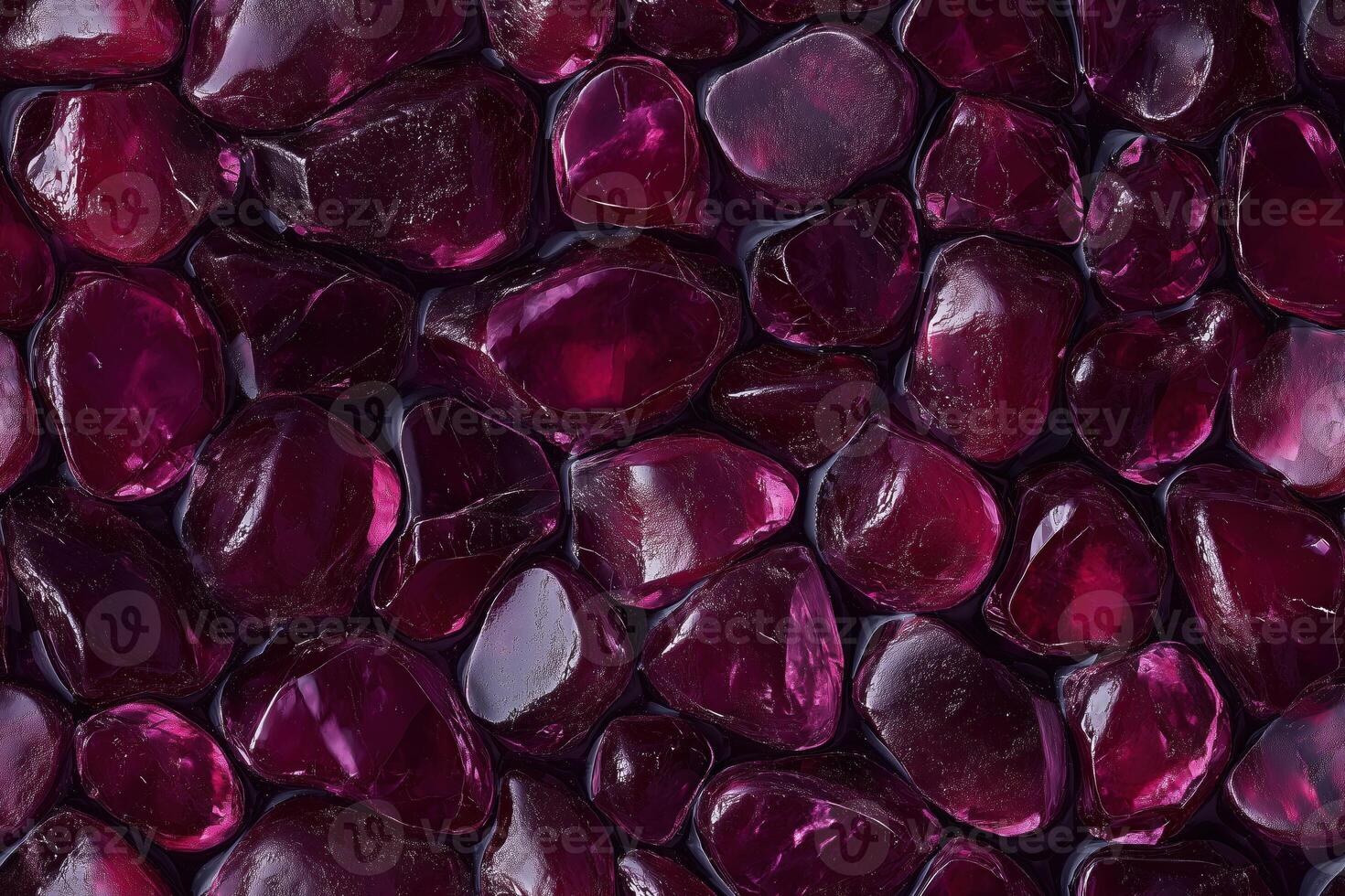 A close up of red stones in a pool photo