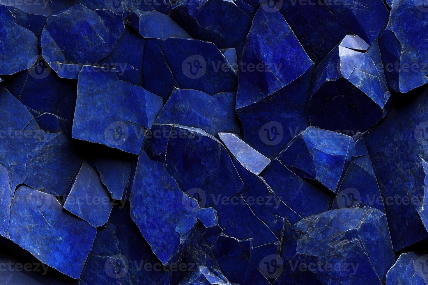 A blue stone wall with many pieces of blue stone photo