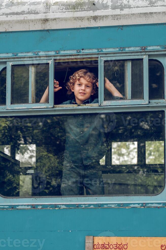 Content boy in train window photo