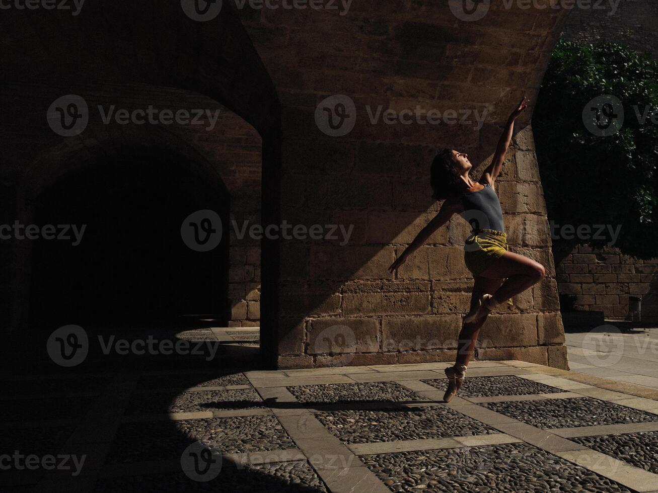 Anonymous ballet dancer performing on street photo