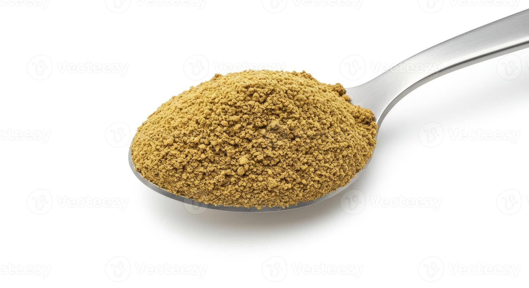 A spoon full of brown powder on a white background photo