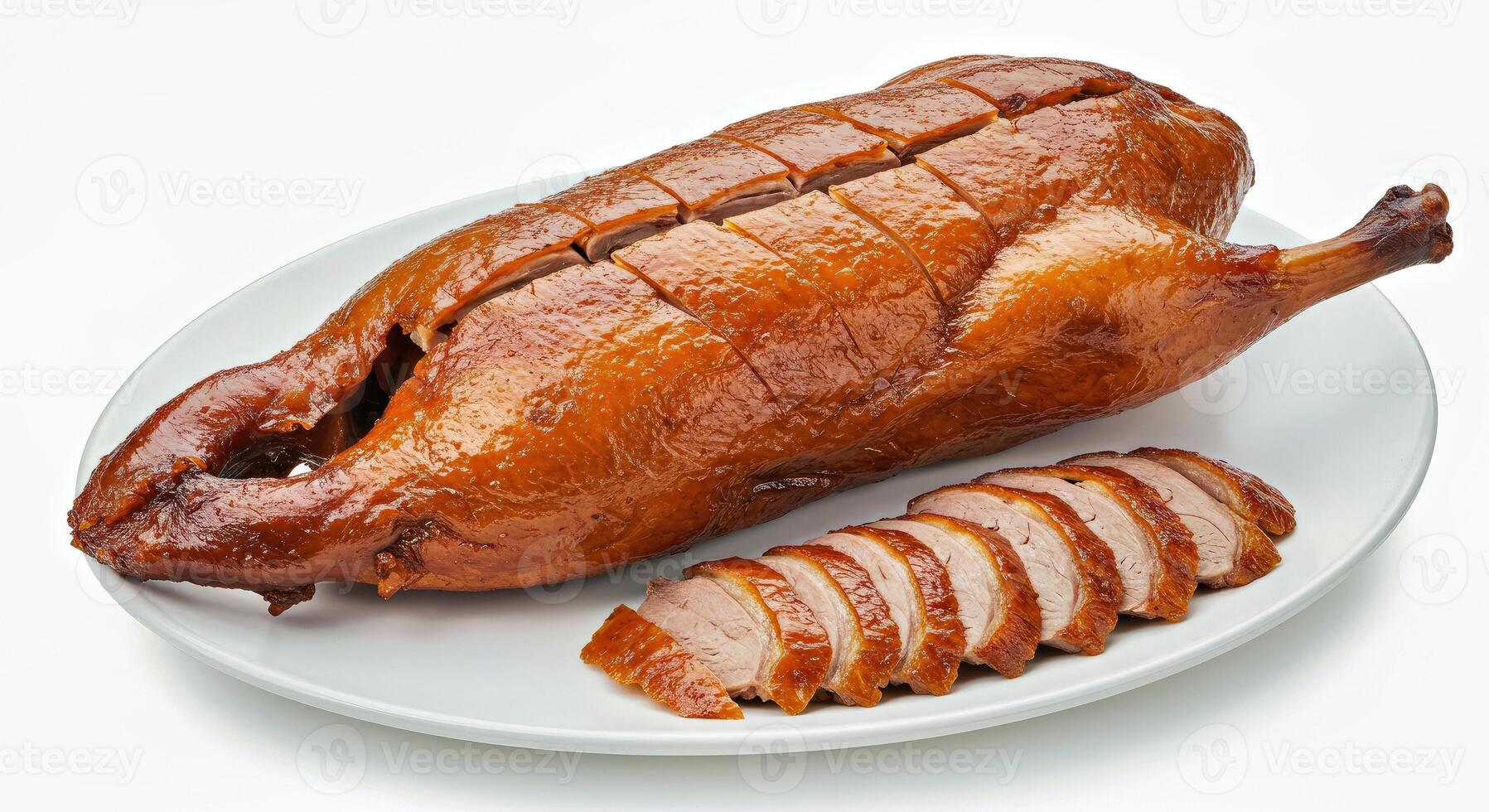 A large roast duck on a plate with sliced meat photo