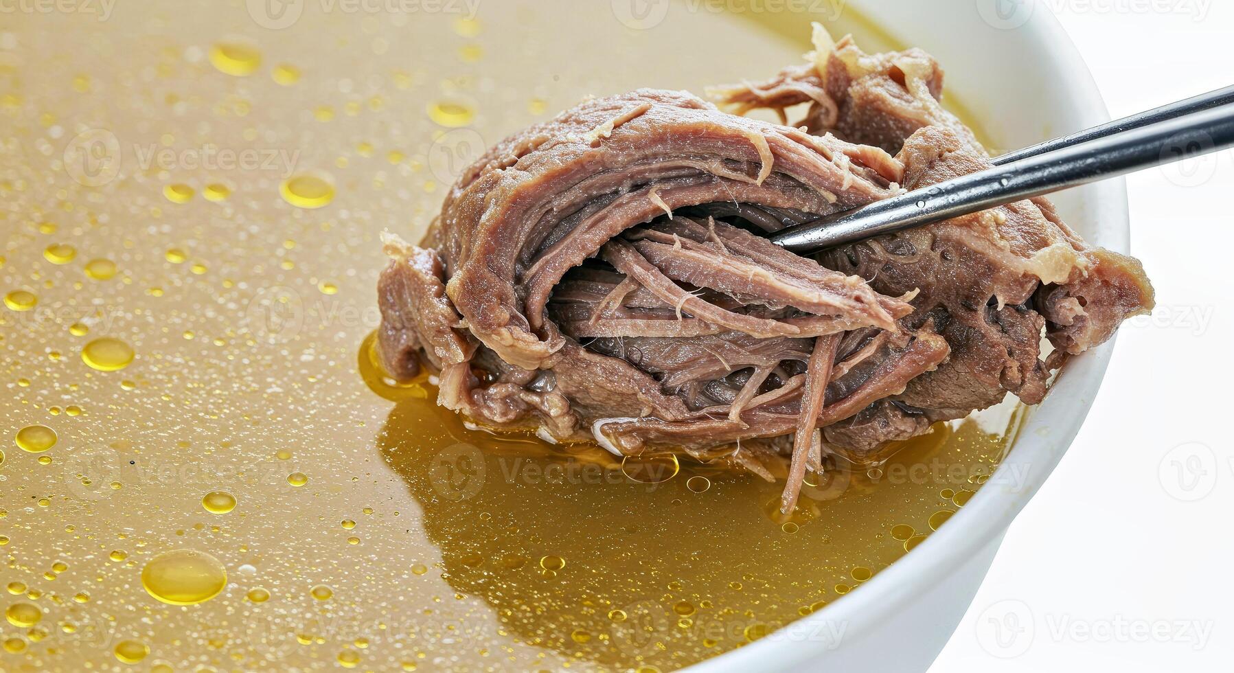 A bowl of soup with a spoon in it photo