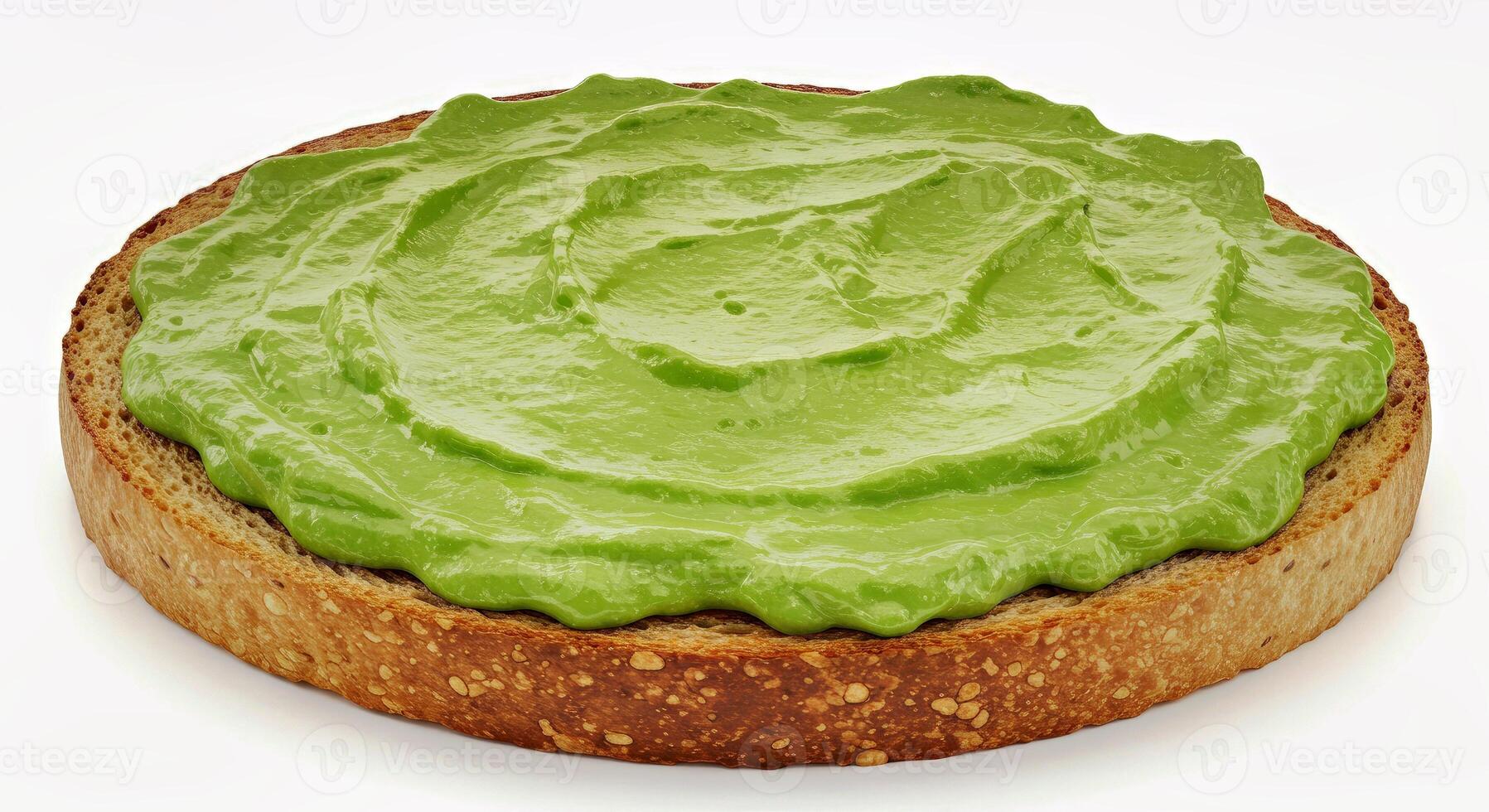 A slice of bread with a green cream on it photo