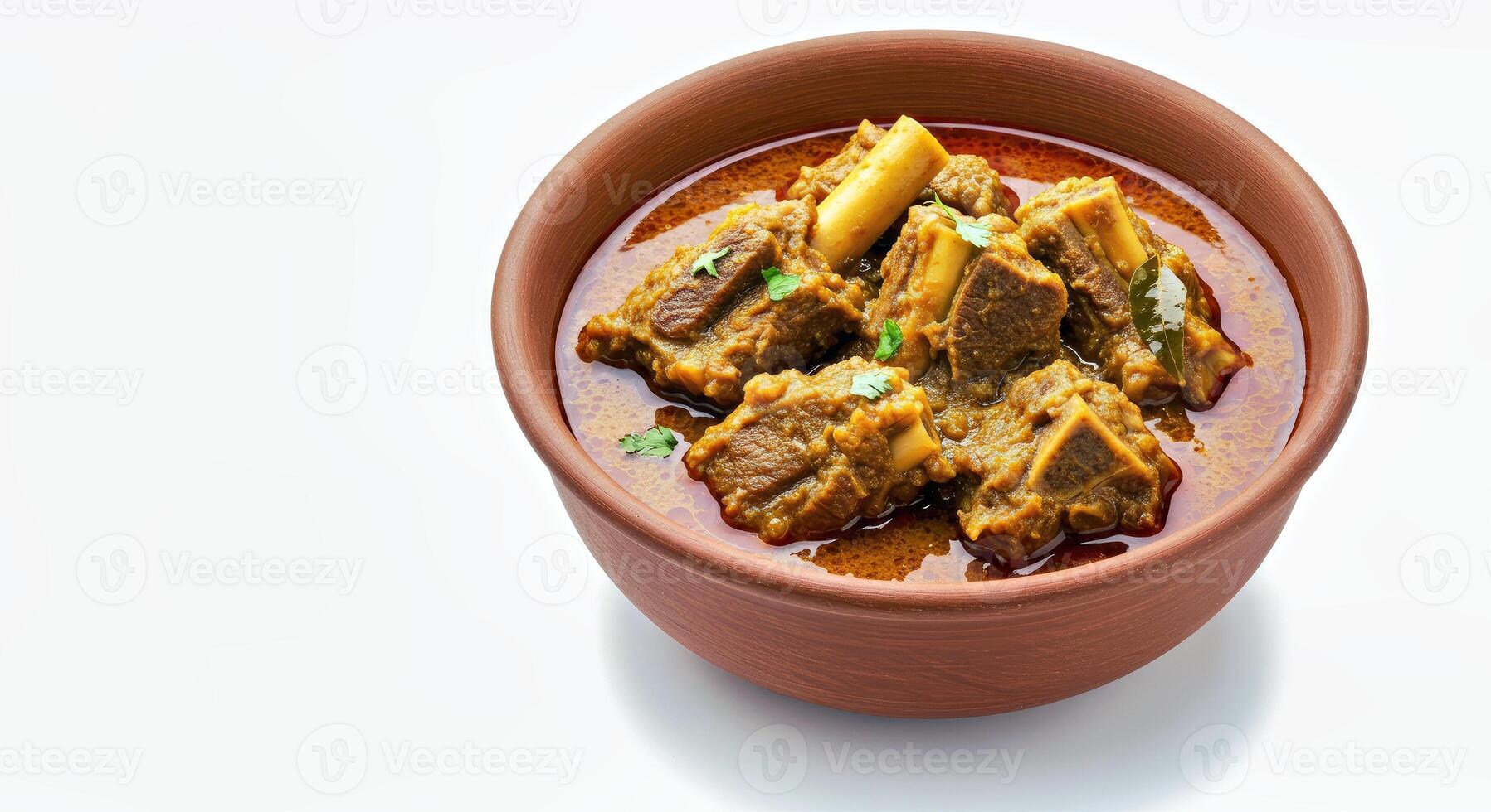 A bowl of meat and vegetables on a white surface photo