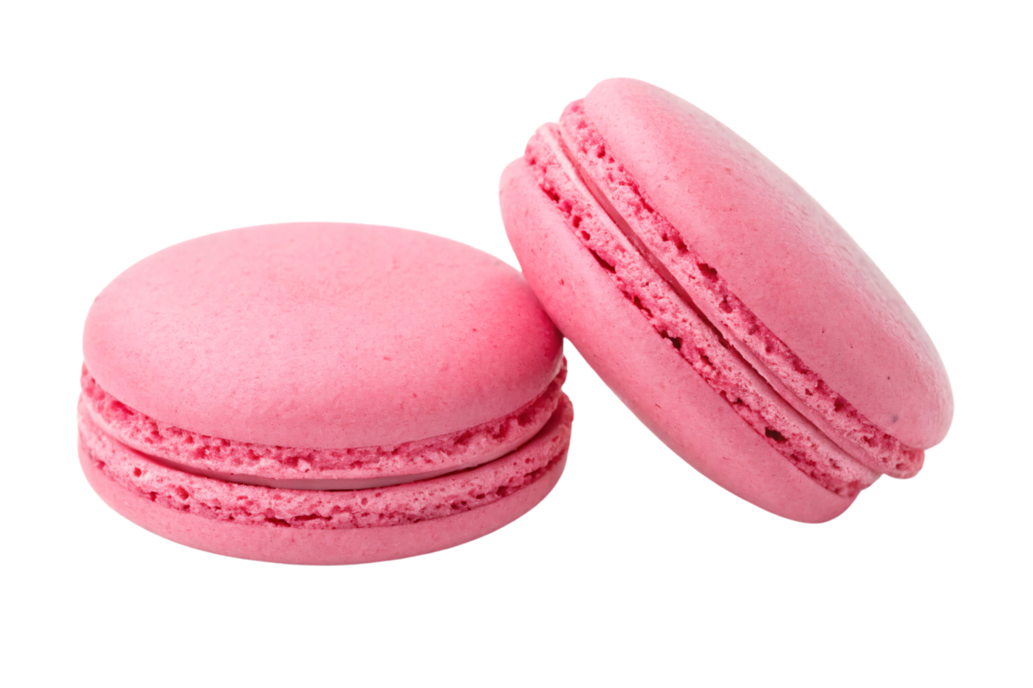 A close-up of pink macarons, highlighting their soft, crumbly texture and creamy filling, placed slightly leaning for a playful arrangement png