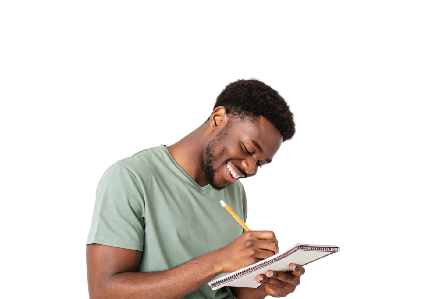 A man in a light green t-shirt grins brightly as he writes in a notebook, exuding a sense of joy and creativity png