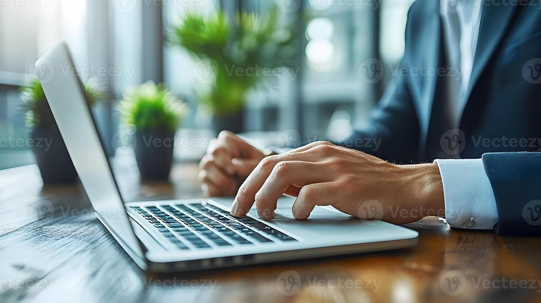 Business team using a laptop discussing business strategies in a stylish open office setting photo