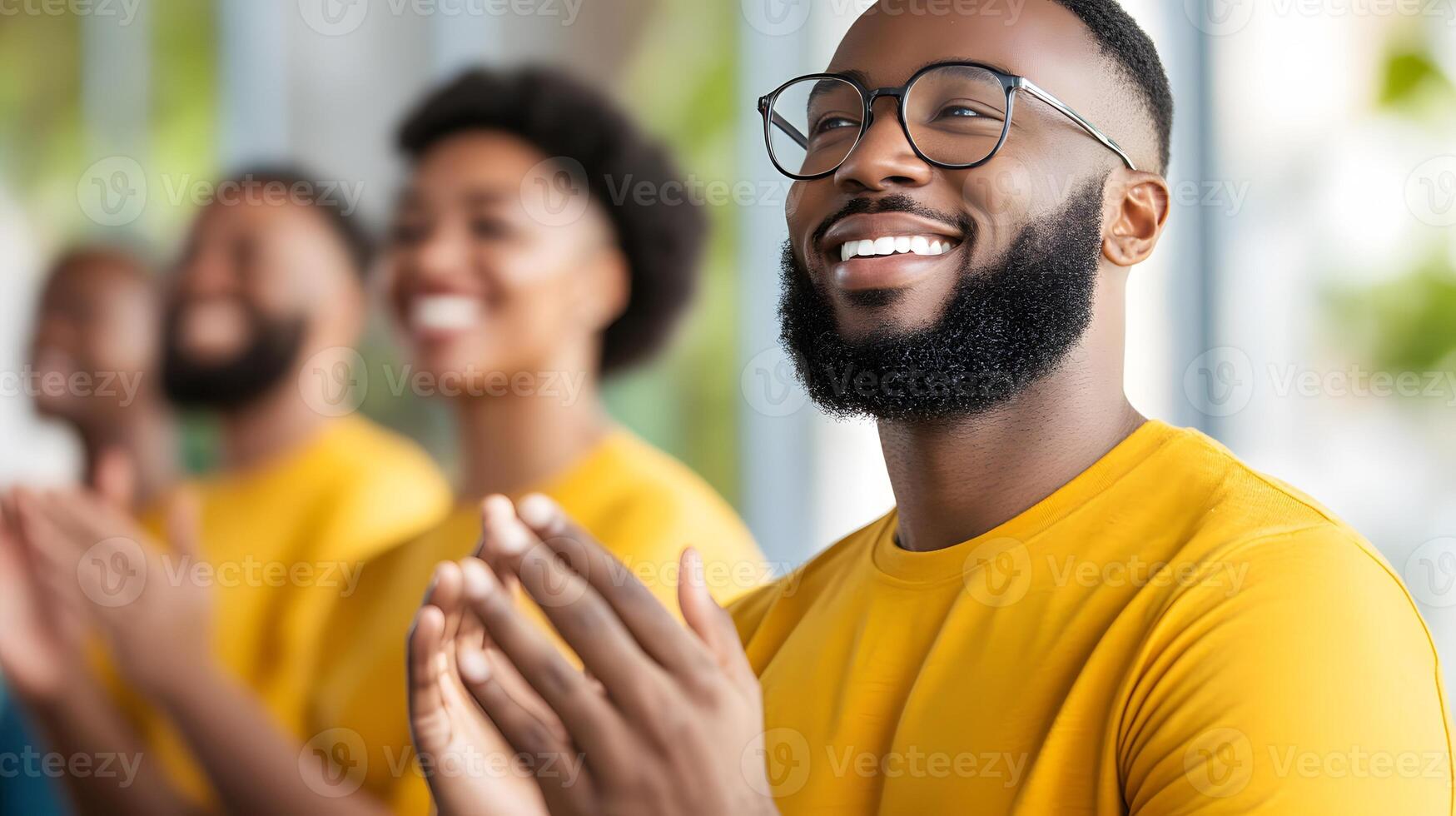 A diverse group of professionals clapping during a team-building activity photo