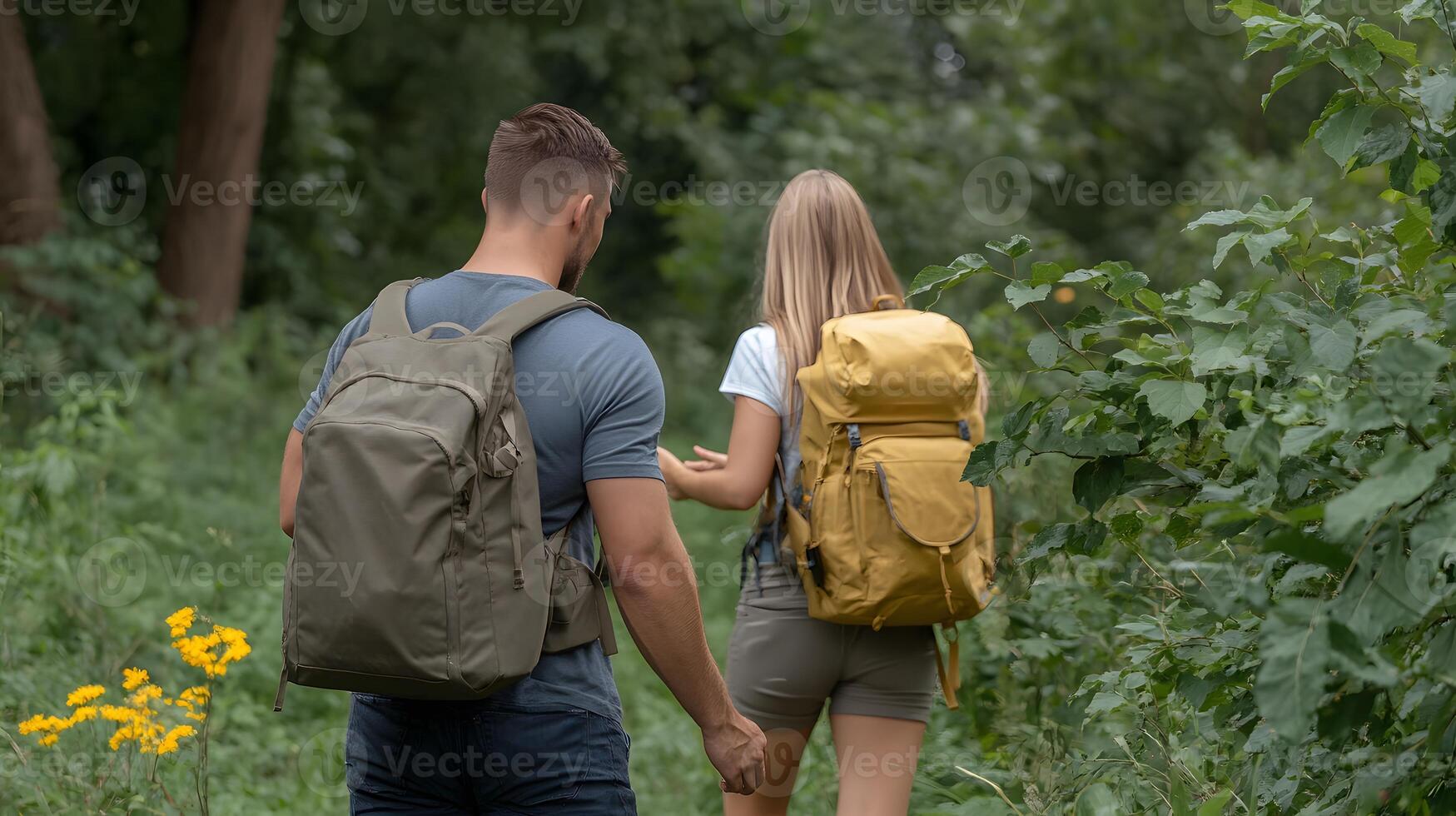Friends helping each other climb a hill during a group hike, symbolizing support photo